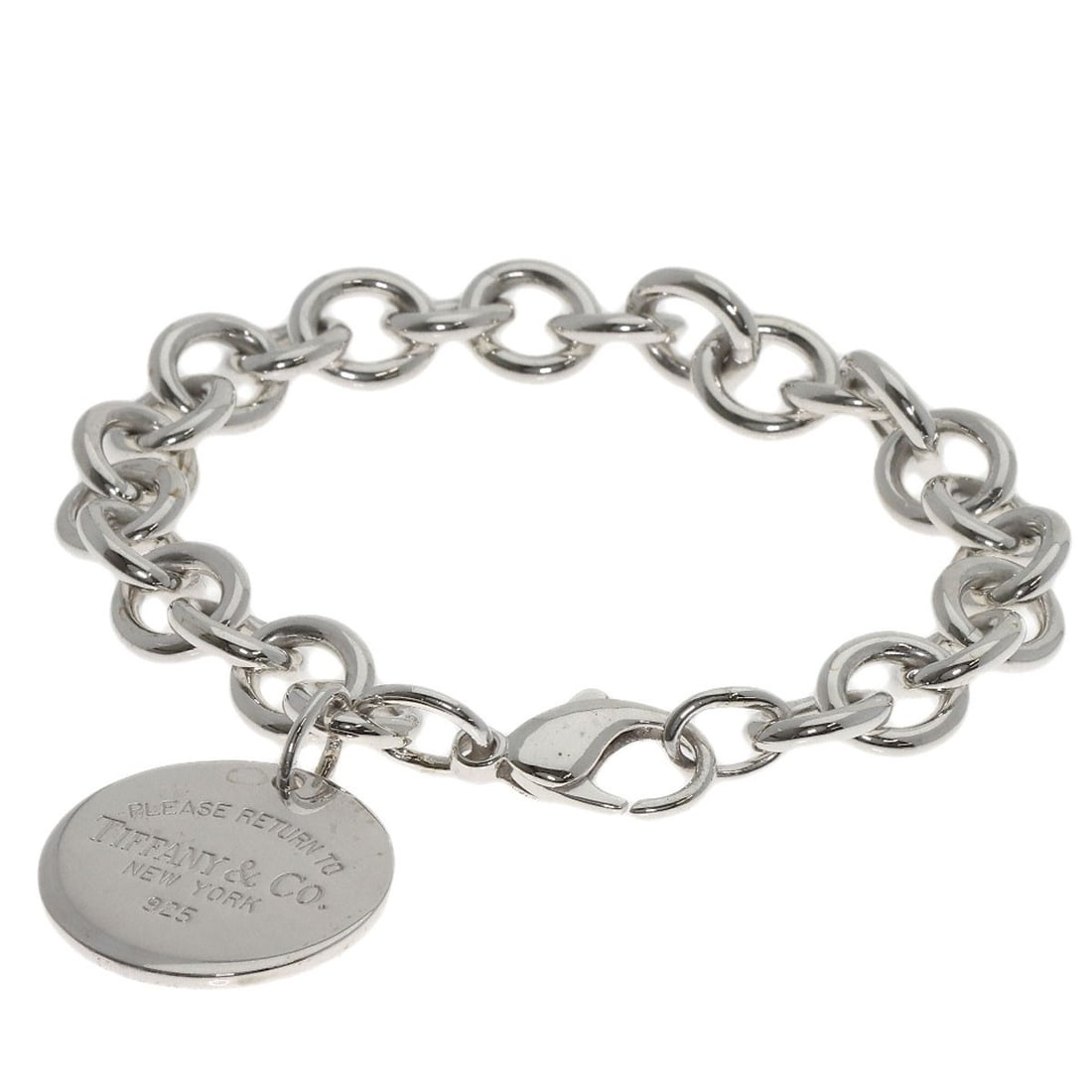 Return to Tiffany & Co Round Silver Bracelet: Return to Tiffany & Co Round Silver Bracelet Silver Round Bracelet from Tiffany & Co., featuring a sleek and modern design with no stone. Made from high-quality silver metal, this bracelet boasts a cl
