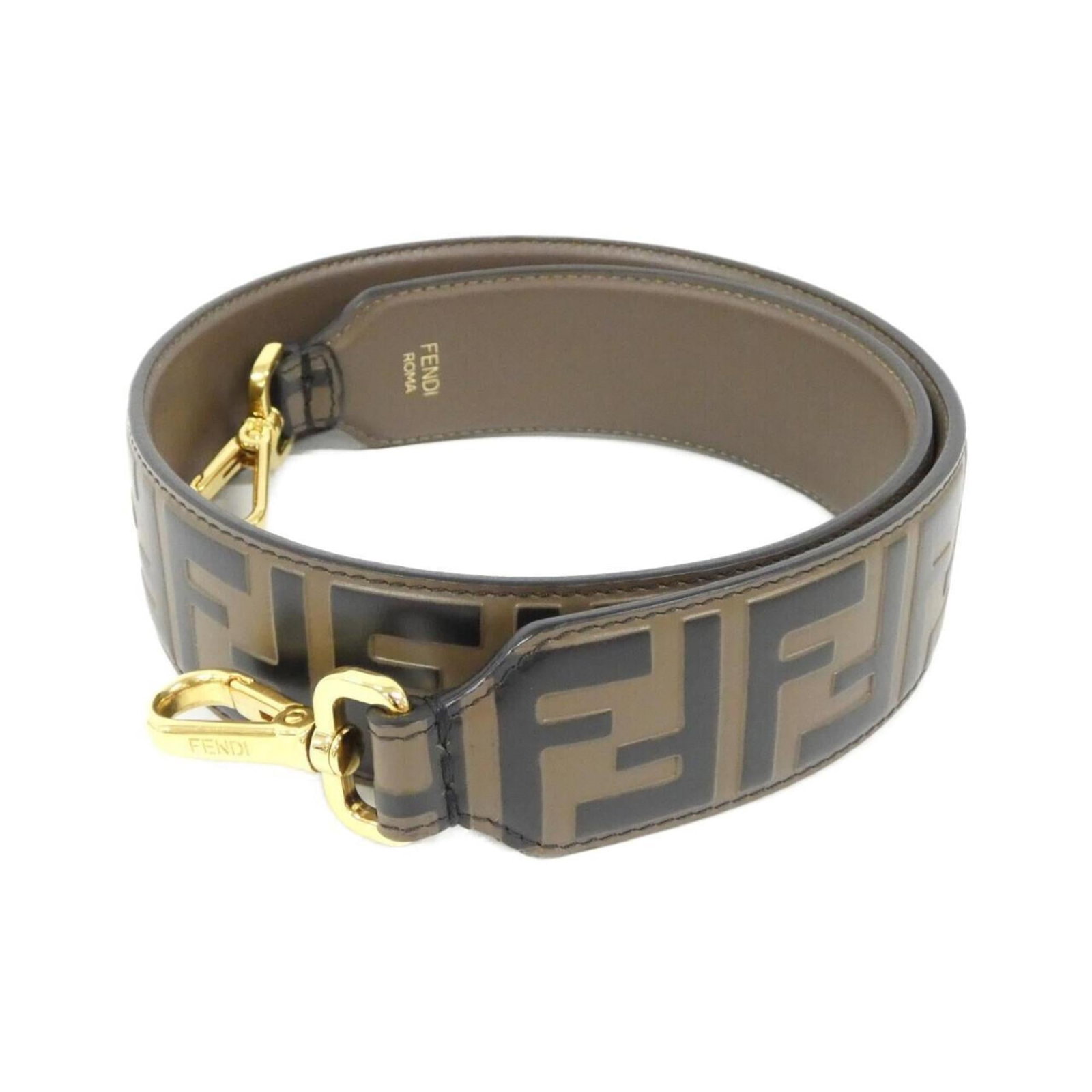 Fendi Strap Leather: Fendi Strap Leather The Fendi Strap Leather is a high-quality, used piece featuring genuine calfskin material and a classic strap design. With its rich leather finish and subtle scratches, this item s