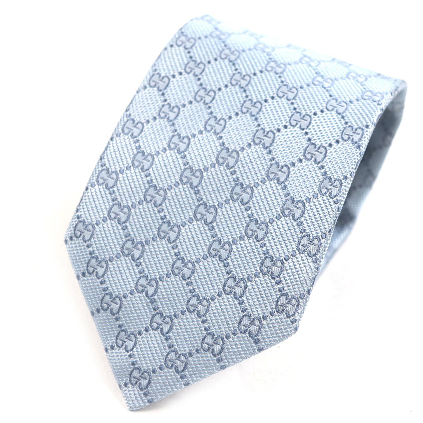 Gucci Cravat: Gucci Cravat Light blue Gucci cravat with a total length of 148cm and a width of 8cm, bearing a signature. This business-style accessory features a subtle design that adds a touch of elegance to any o