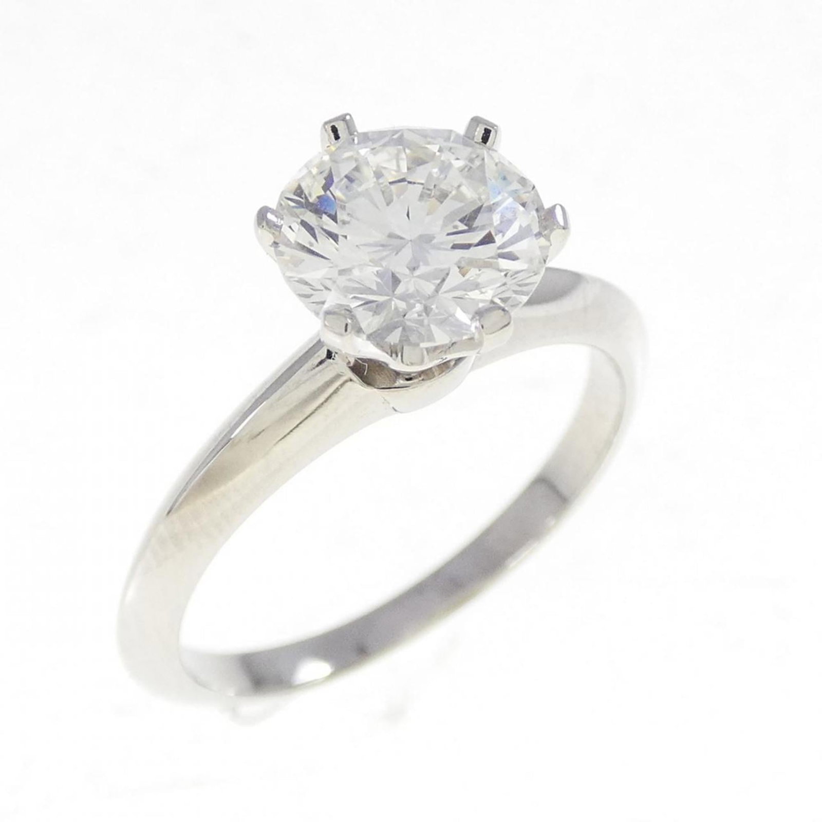 Tiffany Band Ring Platinum 950: Tiffany Band Ring Platinum 950 Platinum band ring from Tiffany featuring a diamond stone. The ring has been used and shows some signs of wear, including scratches and minor dirt, but remains in very g