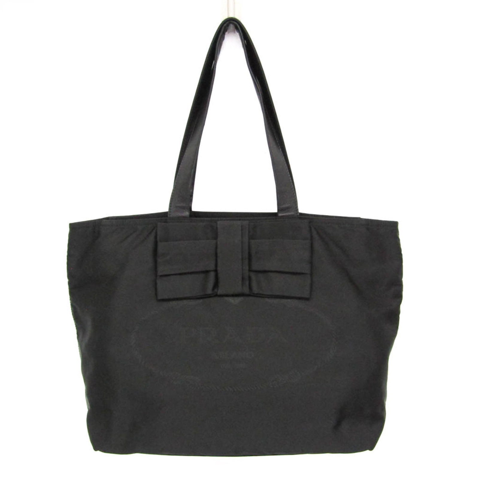 Prada Tote Bag Nylon Leather: Prada Tote Bag Nylon Leather The Prada Tote Bag Nylon Leather features a unique combination of nylon and leather materials, with a sleek black design and zipper closure. A practical open pocket and zi