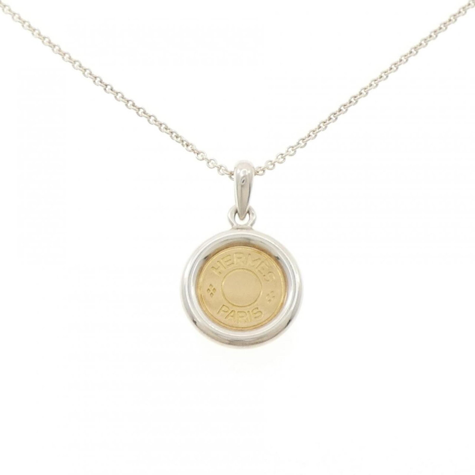 Hermes Sellier Necklace: Hermes Sellier Necklace Silver and yellow gold 18K Hermes Sellier Necklace with pendant size of 30.9mm x 20mm, suitable for neck circumference of 39-41 cm. The necklace features a few traces of
