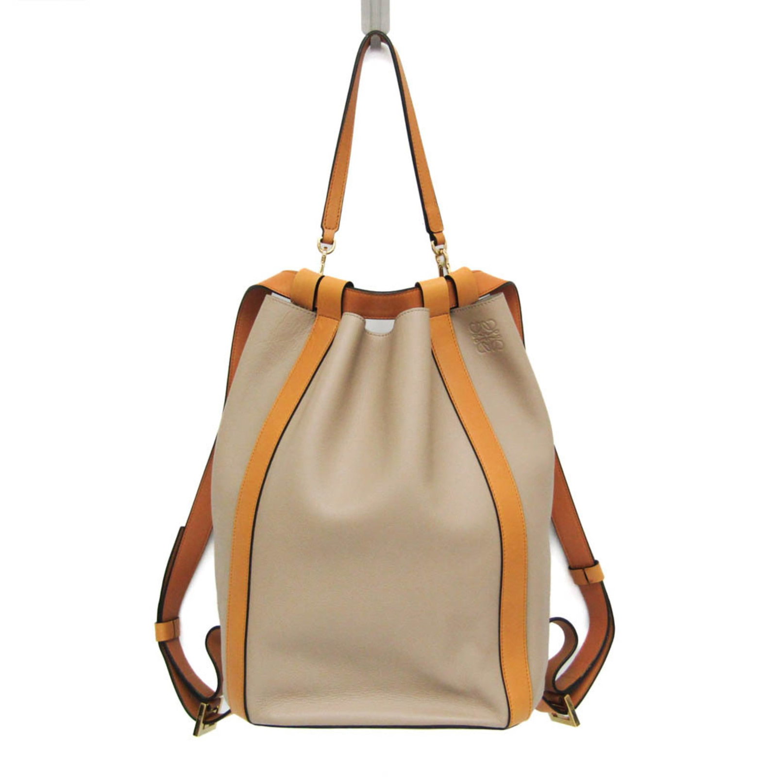 Loewe Backpack Handbag Leather: Loewe Backpack Handbag Leather The Loewe Backpack Handbag Leather is a stylish and versatile accessory featuring high-quality beige and yellow leather. With its adjustable strap length of 60cm-70cm