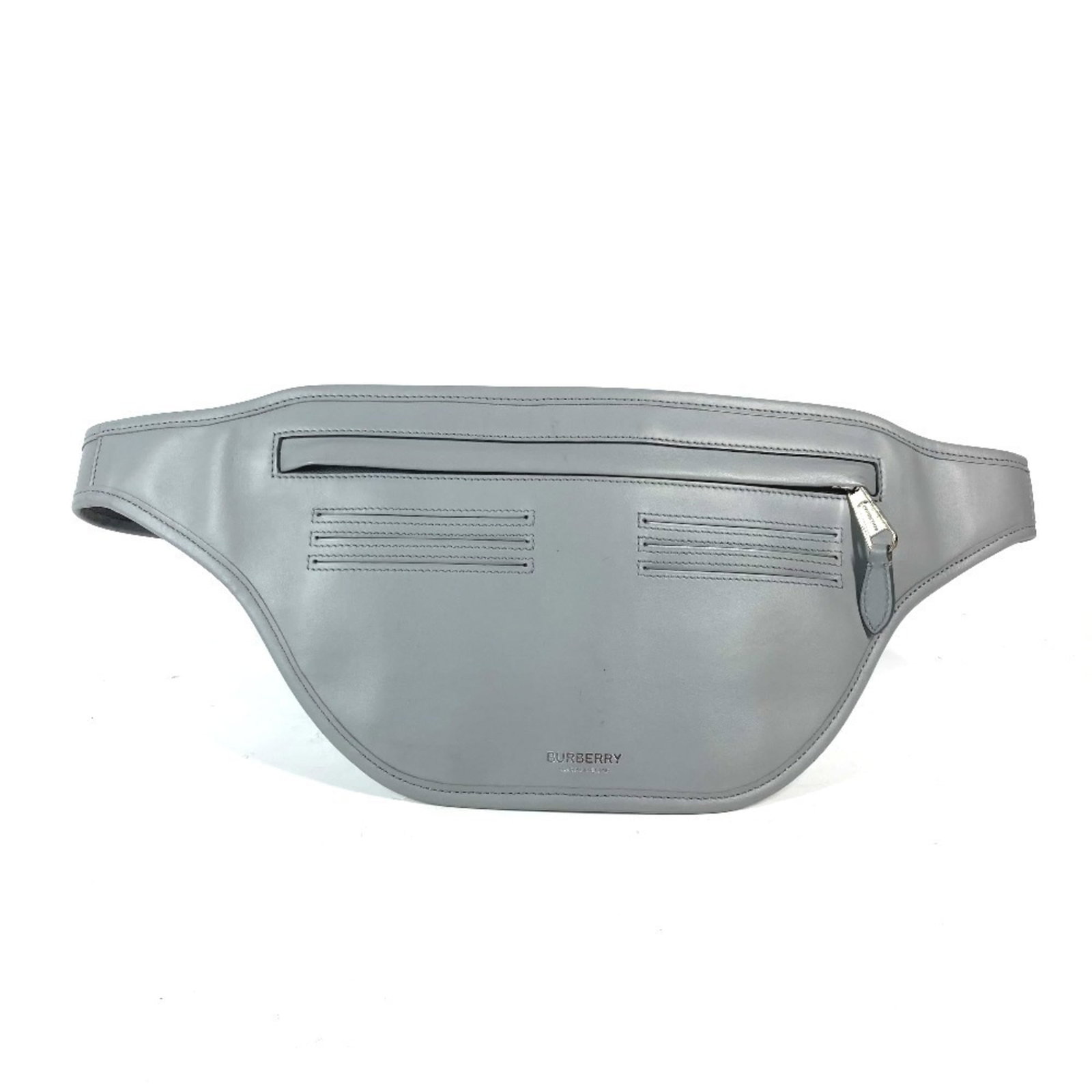 Burberry Fanny Pack Leather: Burberry Fanny Pack Leather Burberry's iconic fanny pack is made from high-quality leather in a versatile gray color. The classic design features a timeless 17.5cm x 16.5cm size and a few subtle signs
