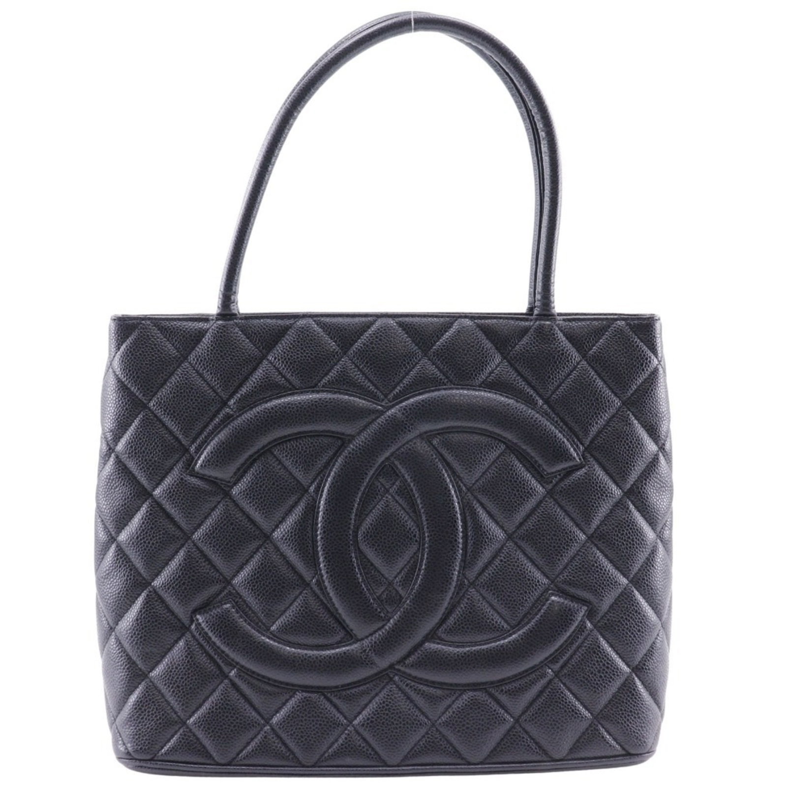 Chanel Tote Bag Caviar Leather: Chanel Tote Bag Caviar Leather Caviar leather Chanel tote bag in black with silver hardware and a zipper closure. This used bag features some scratches and dirt, but remains in very good condition ove