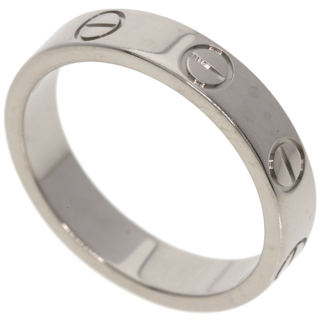 Love ring in white gold: Love ring in white gold K18 white gold gives this love ring its sleek and modern appearance. With no stone to add extra sparkle, the focus remains on the clean lines of the metalwork, showcasing its