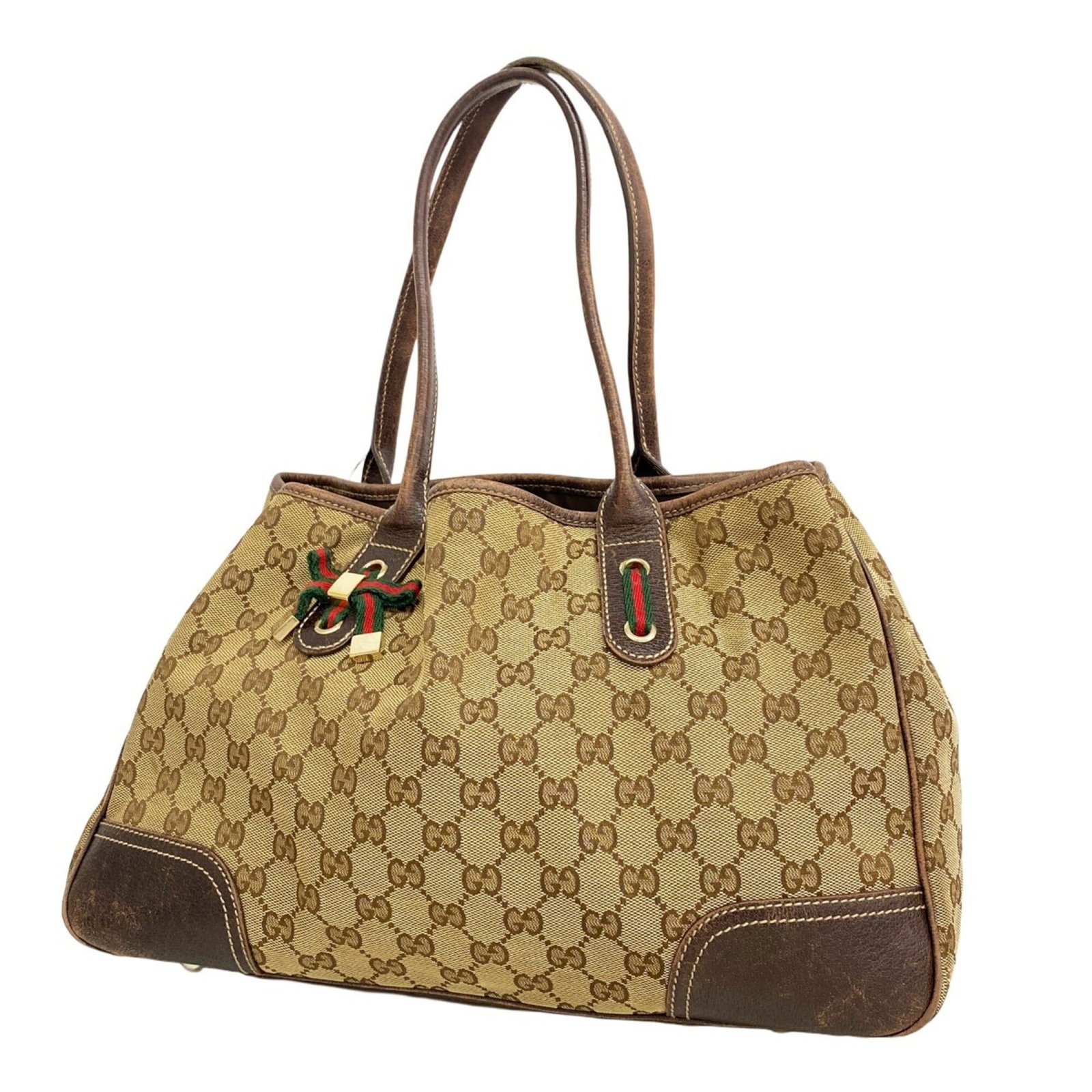 Gucci Tote Bag Canvas: Gucci Tote Bag Canvas Gucci's iconic canvas tote bag boasts a timeless brown hue and elegant gold hardware. Measuring 23cm x 38cm x 10cm, this versatile bag features a classic design that can be easil