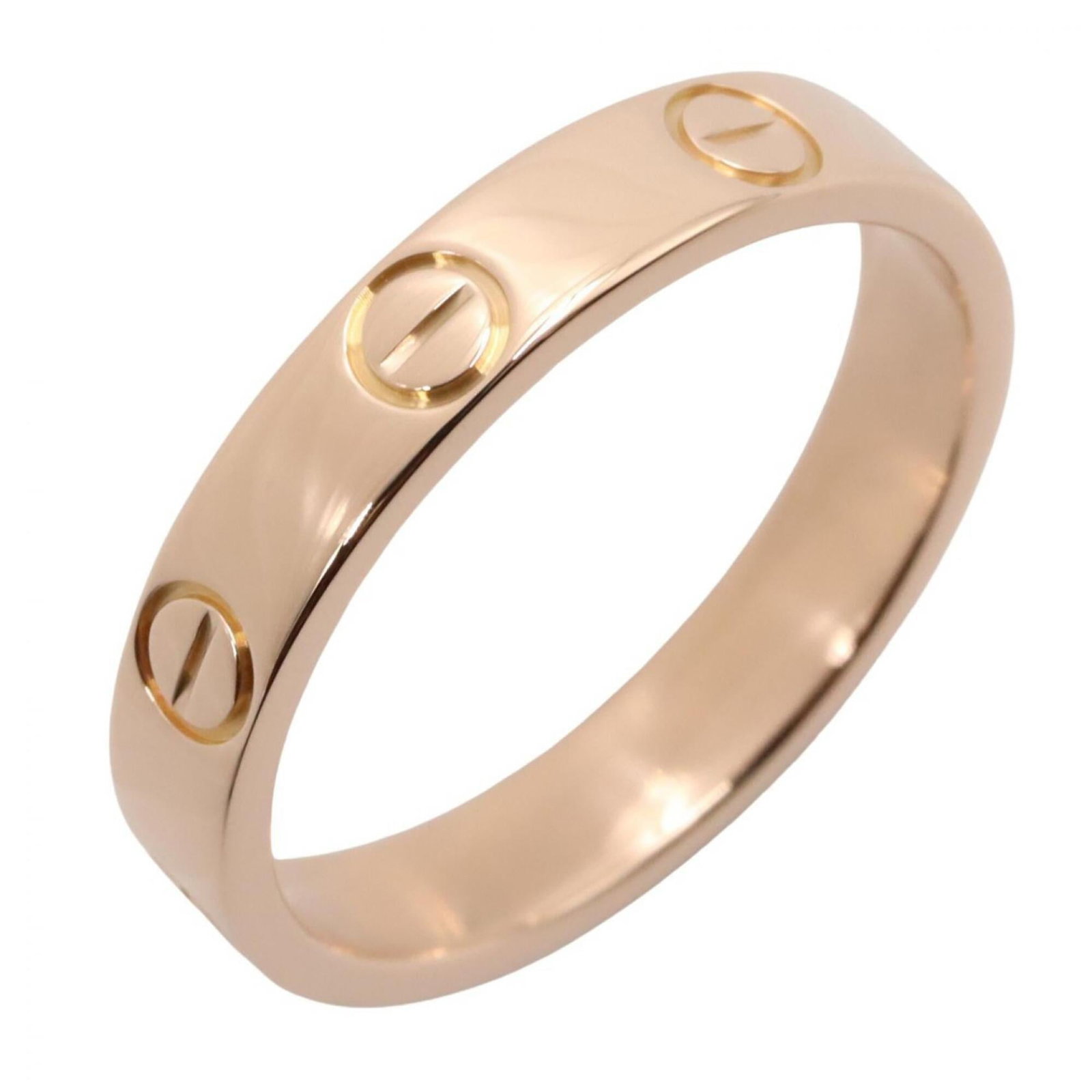 Cartier Band Ring Pink Gold (18K): Cartier Band Ring Pink Gold (18K) Cartier Band Ring in Pink Gold (18K) features a delicate pink gold band with a subtle sheen. The ring has some minor scratches and dirt, but remains in very good cond