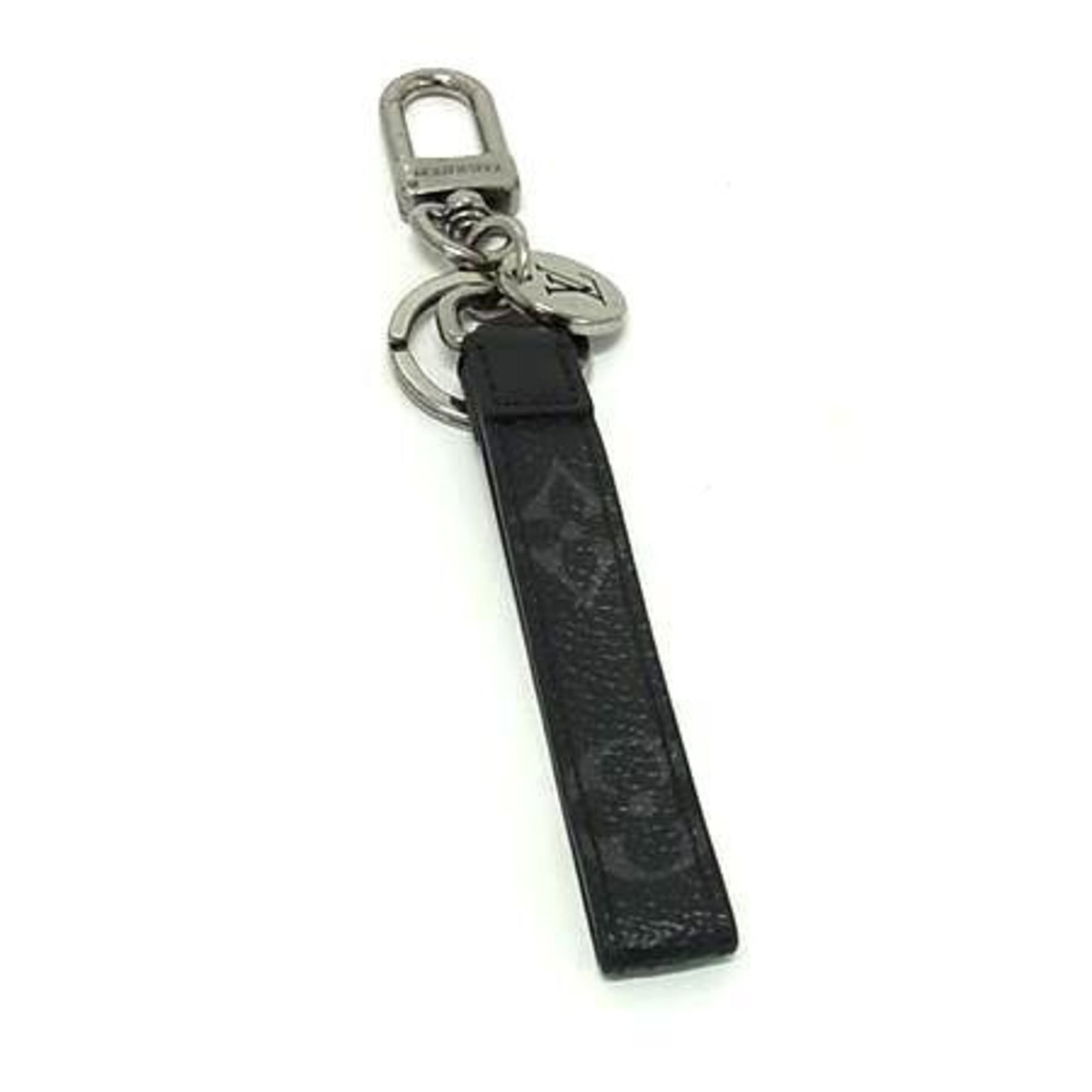 Louis Vuitton Keyring Leather: Louis Vuitton Keyring Leather Black and gray Louis Vuitton leather keyrings are available. The items have traces of usage with scratches and dirt visible, indicating they are used (good) condition. It