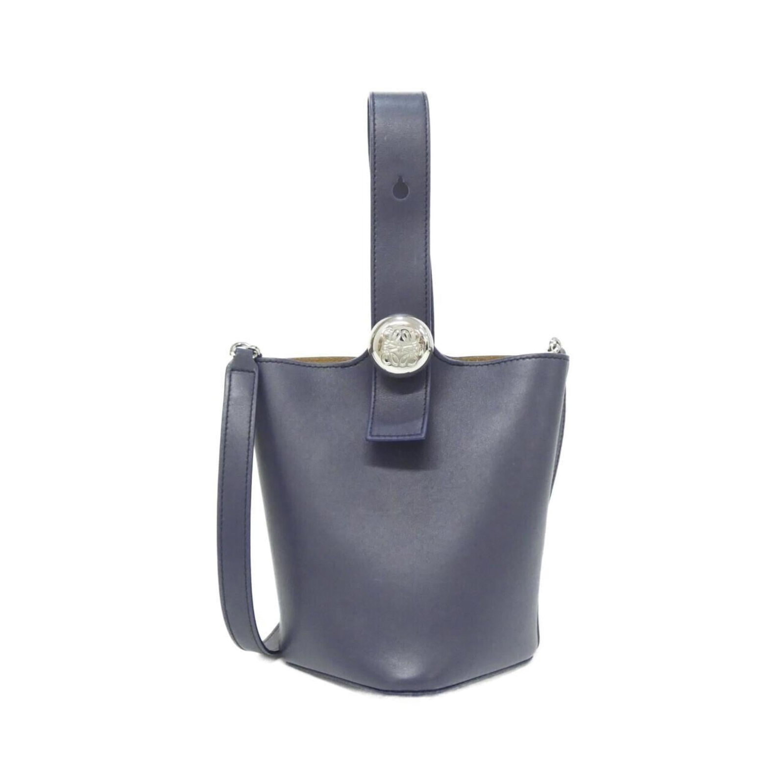Loewe Handbag Leather: Loewe Handbag Leather The Loewe Handbag Leather is a stylish and durable accessory made from high-quality calfskin leather. Its sleek blue color and silver hardware add a touch of sophistication to