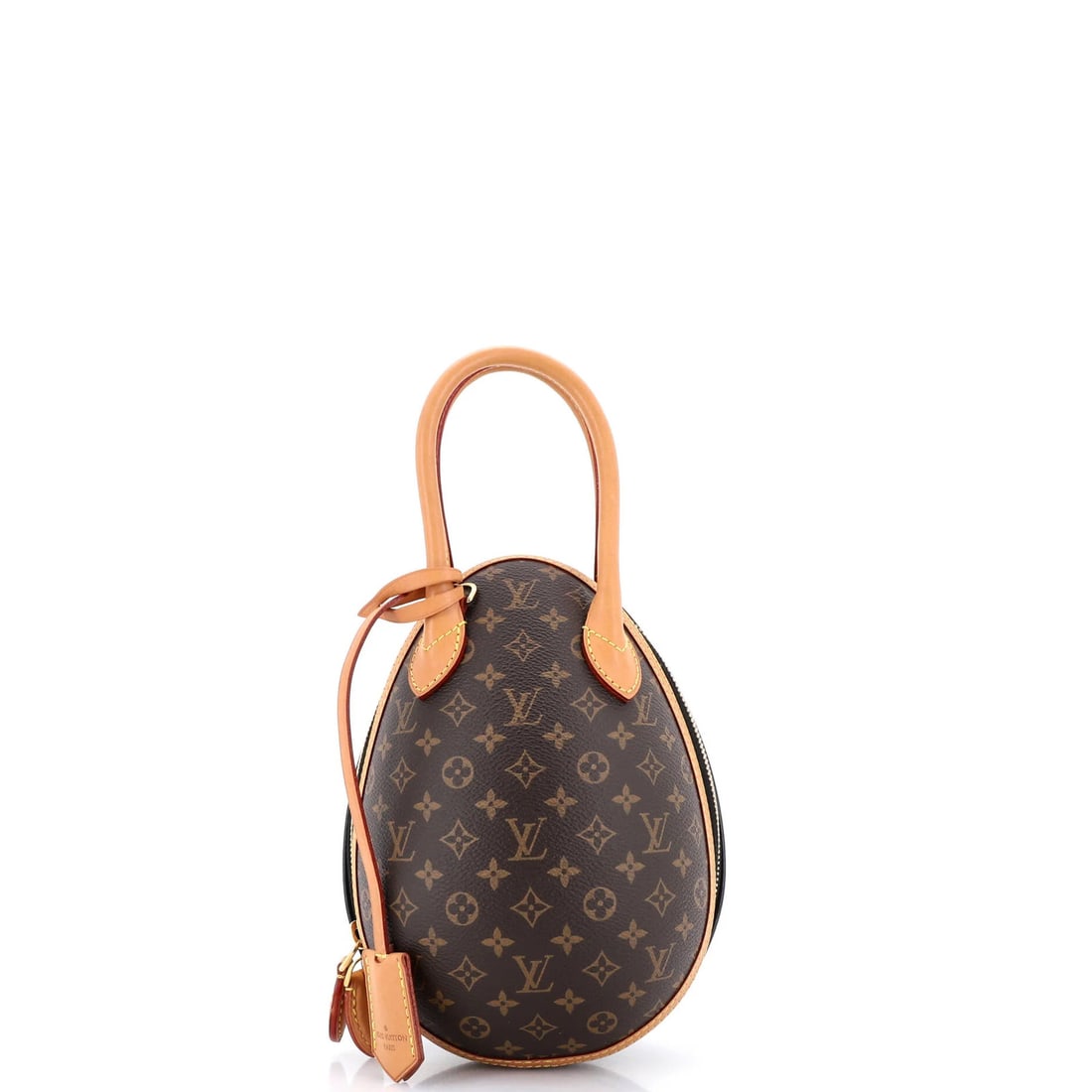 Monogram canvas leather egg bag by Louis Vuitton: Monogram canvas leather egg bag by Louis Vuitton The Louis Vuitton Monogram Canvas and Leather Egg Bag features a timeless design with scuffs on the exterior, adding a touch of character to its classi