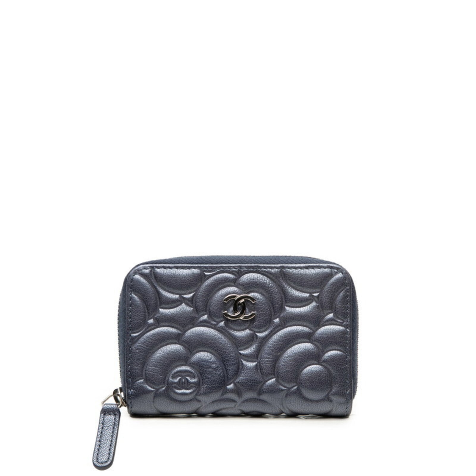Chanel Coin Purse/Coin Case Leather: Chanel Coin Purse/Coin Case Leather Navy or purple leather coin purse/case with classic Chanel design. Traces of usage and minor scratches can be seen on this pre-owned item, which still retains its o