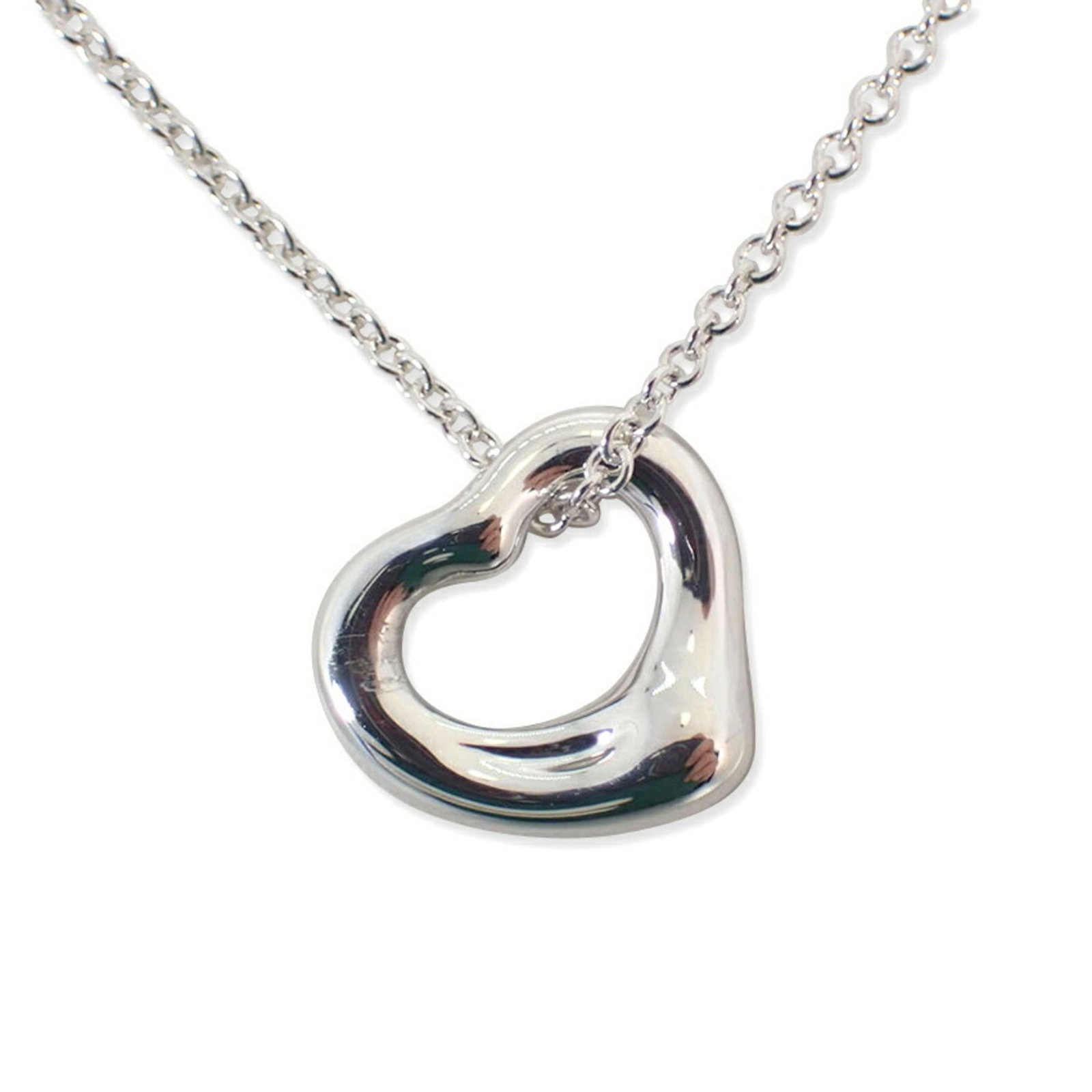Tiffany Tiffany Silver Ag925 Heart Pendant: Tiffany Tiffany Silver Ag925 Heart Pendant Tiffany Tiffany Silver Ag925 Heart Pendant - A beautiful, used heart pendant made from sterling silver (Ag925) with a subtle shine. The pendant measures 10mm