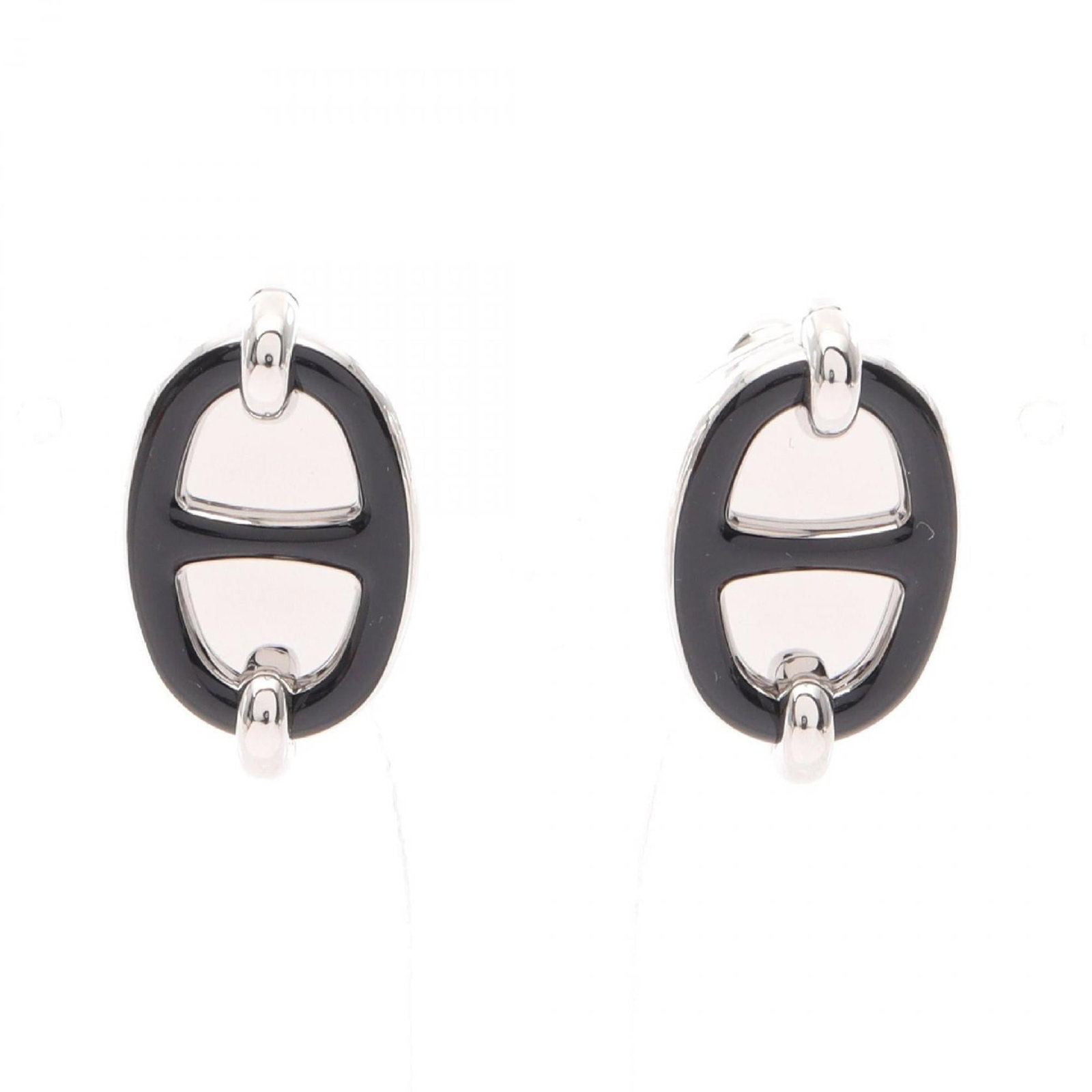 Hermes Stud Earrings Stainless Steel: Hermes Stud Earrings Stainless Steel Stainless steel stud earrings from Hermes feature a sleek black finish. The earrings have a subtle size and are in very good condition with some minor scratches