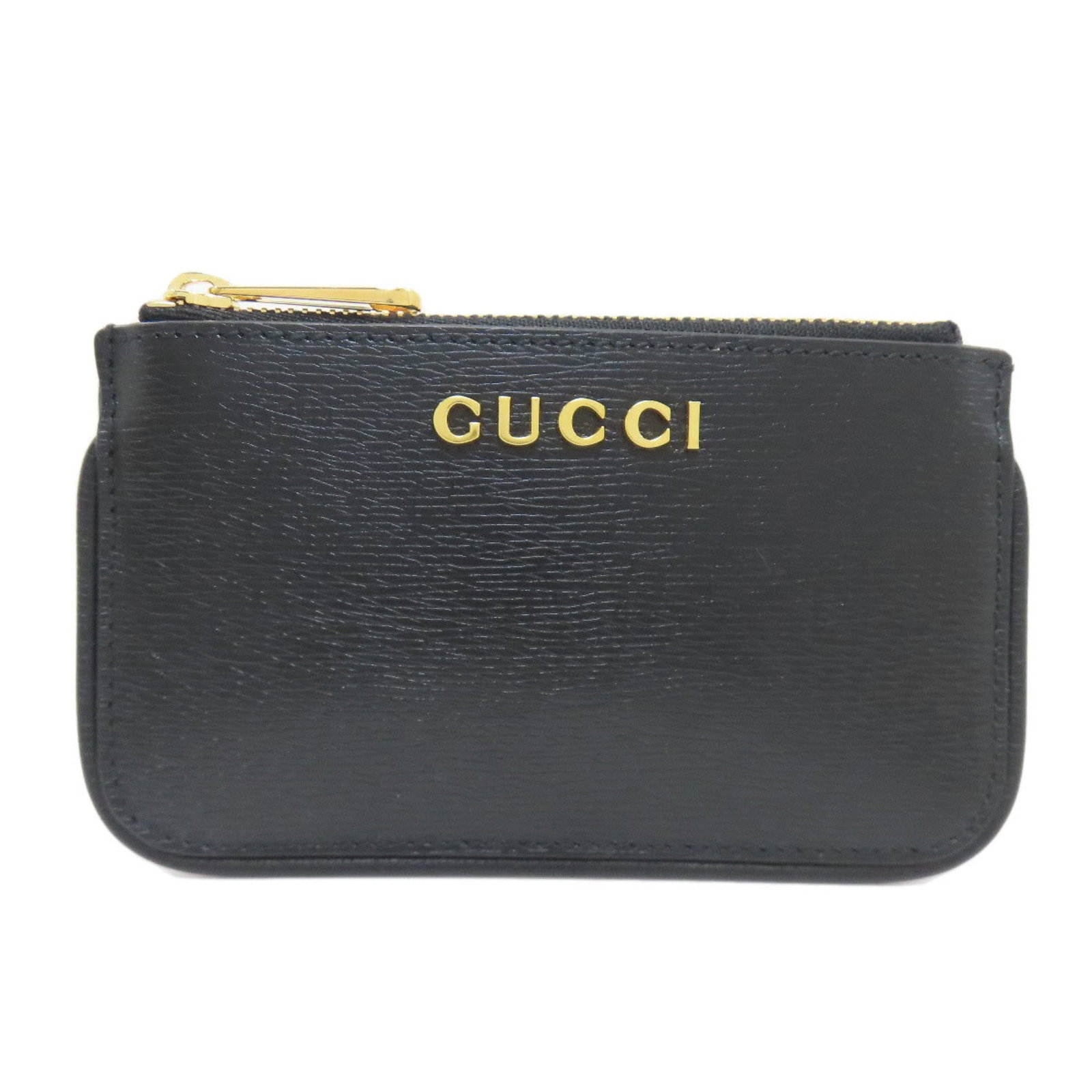 Gucci Coin Purse/Coin Case Leather: Gucci Coin Purse/Coin Case Leather The Gucci Coin Purse/Coin Case Leather is a sleek and sophisticated accessory made from high-quality black leather. Its compact size and secure zipper closure make i