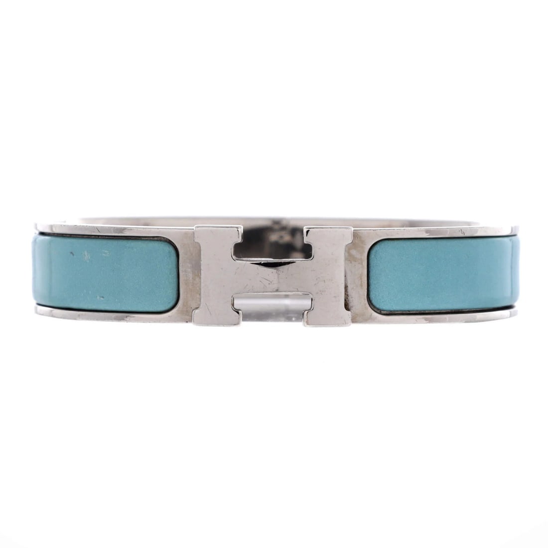 Clic Hermes Narrow Bracelet Enamel: Clic Hermes Narrow Bracelet Enamel Clic H Bracelet Enamel in blue and silver features an enamel metal design with moderate scratches throughout its circumference of 6.5 inches and width of 12 inches. 