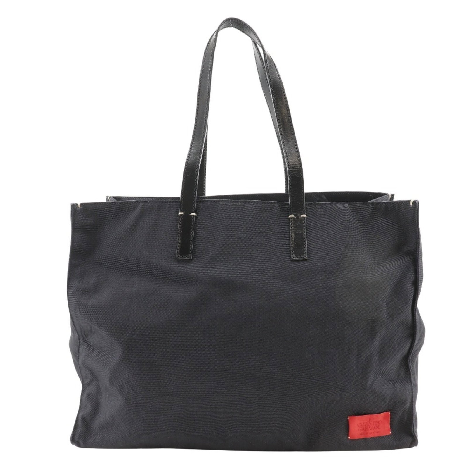 Valentino Tote Bag Nylon Canvas: Valentino Tote Bag Nylon Canvas Valentino's iconic tote bag boasts a sleek black nylon canvas design, offering a timeless and versatile accessory for everyday use. Measuring 33cm x 44cm x 21cm, this