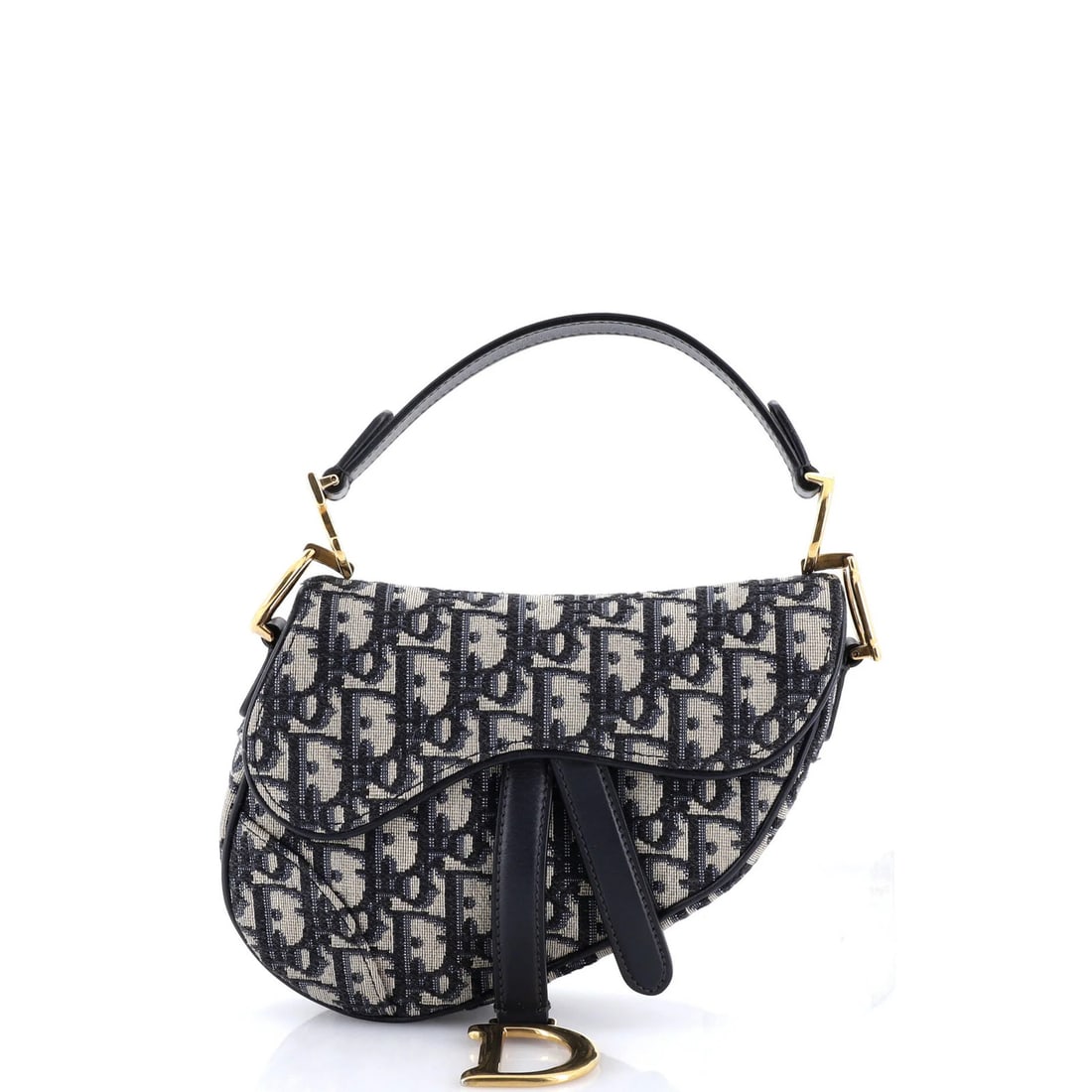 Canvas Mini Bag Christian Dior Oblique Saddle: Canvas Mini Bag Christian Dior Oblique Saddle Canvas Mini Bag Christian Dior Oblique Saddle features a striking blue canvas exterior with neutral interior and aged gold hardware. This miniature
