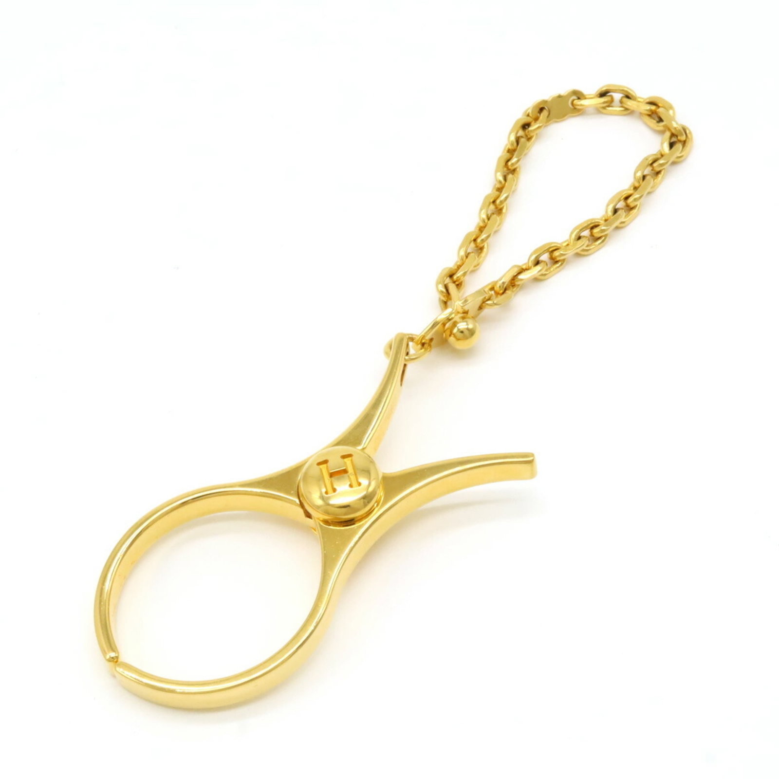Hermes Glove Holder: Hermes Glove Holder Gold Plated Hermes Glove Holder with a sleek design and sturdy gold plated construction. This compact holder measures 6cm x 2.7cm and features a 13cm long handle for secure grip. W