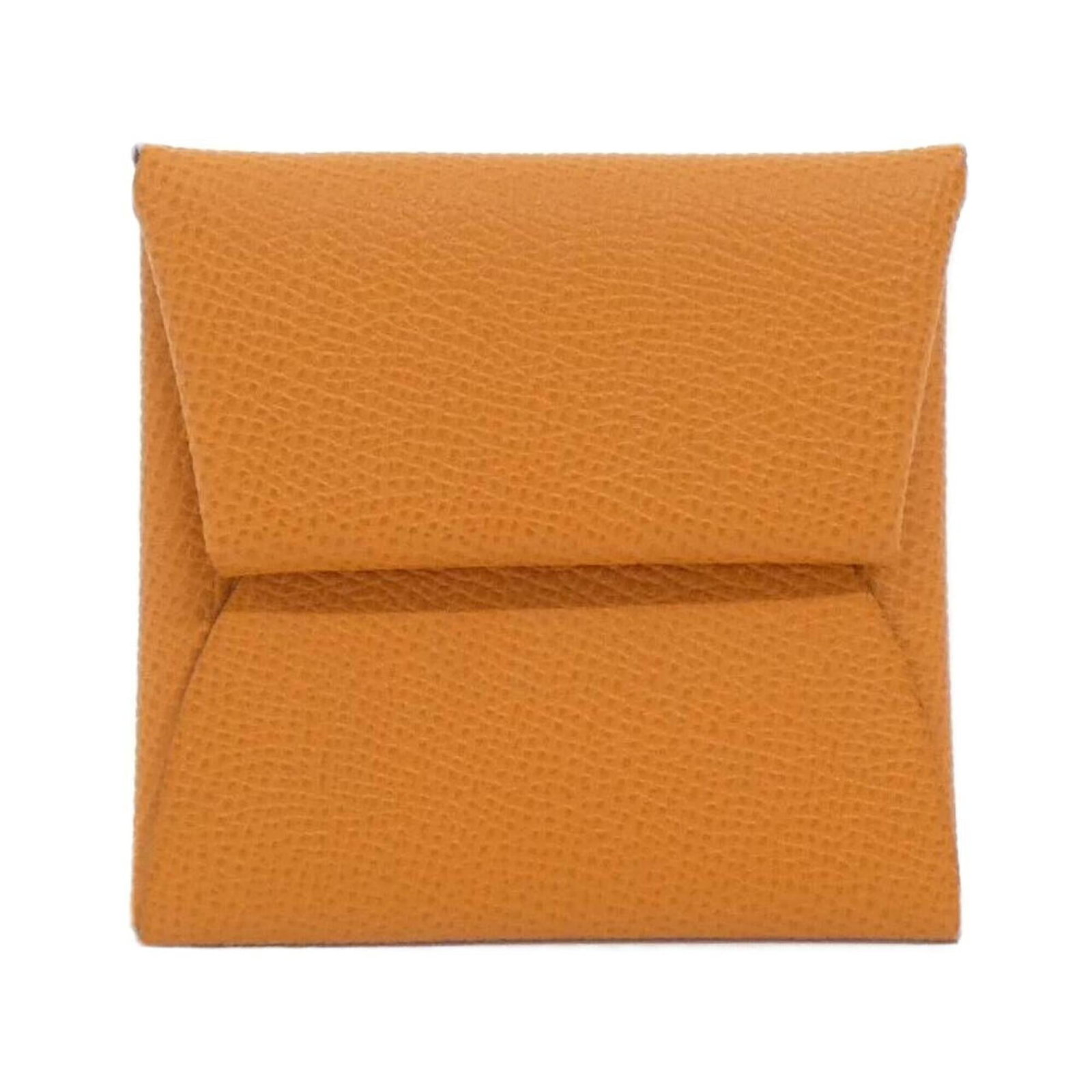 Hermes Coin Purse/Coin Case Epsom Leather: Hermes Coin Purse/Coin Case Epsom Leather The Hermes Coin Purse/Coin Case Epsom Leather boasts a vibrant orange hue and sleek design. Made from high-quality Epsom leather, this coin purse features a