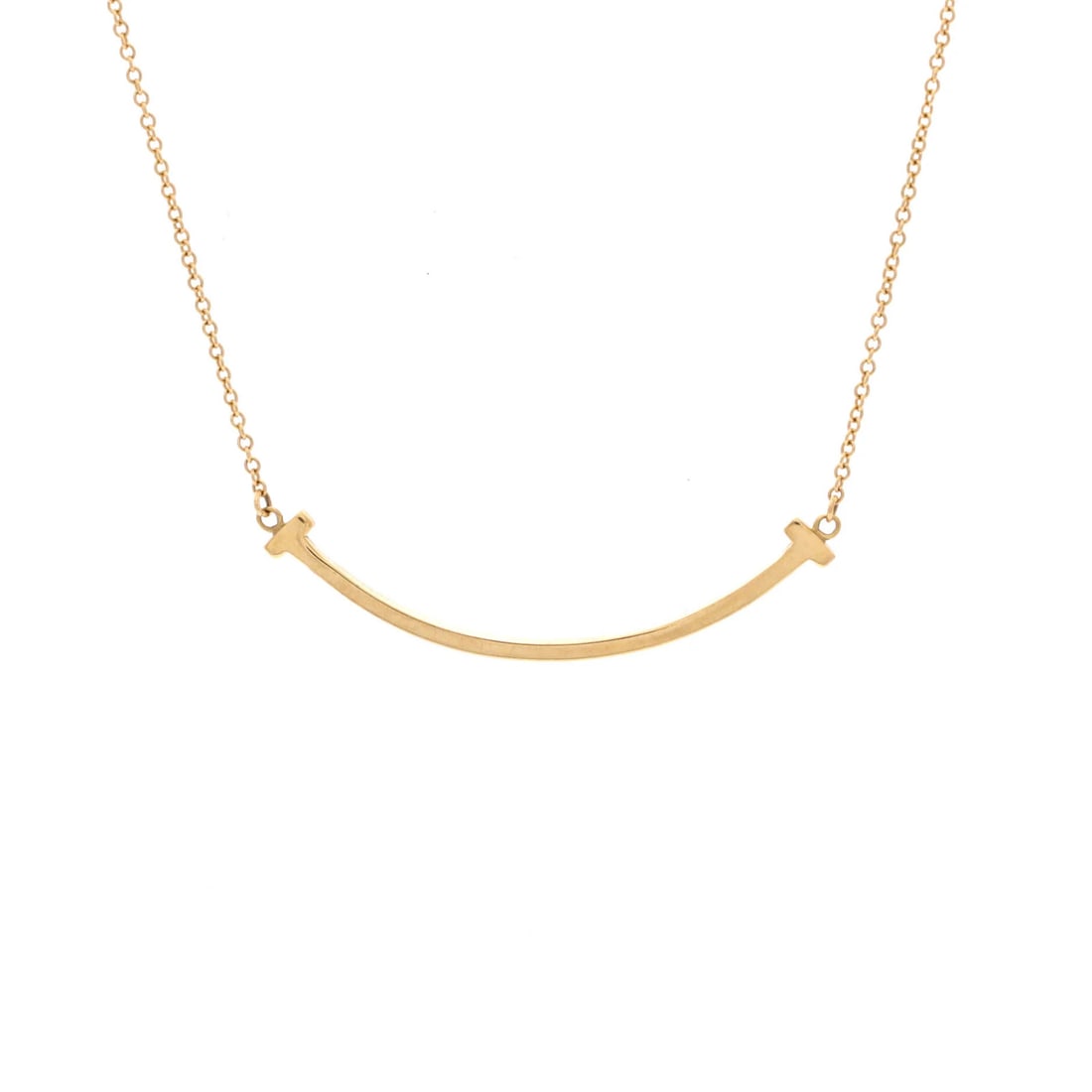 Smile Pendant Necklace Small 18K Yellow Gold Tiffany: Smile Pendant Necklace Small 18K Yellow Gold Tiffany Small 18K Yellow Gold Tiffany Smile Pendant Necklace. This delicate necklace features a 9.60 mm x 37.70 mm yellow gold pendant with moderate wear t
