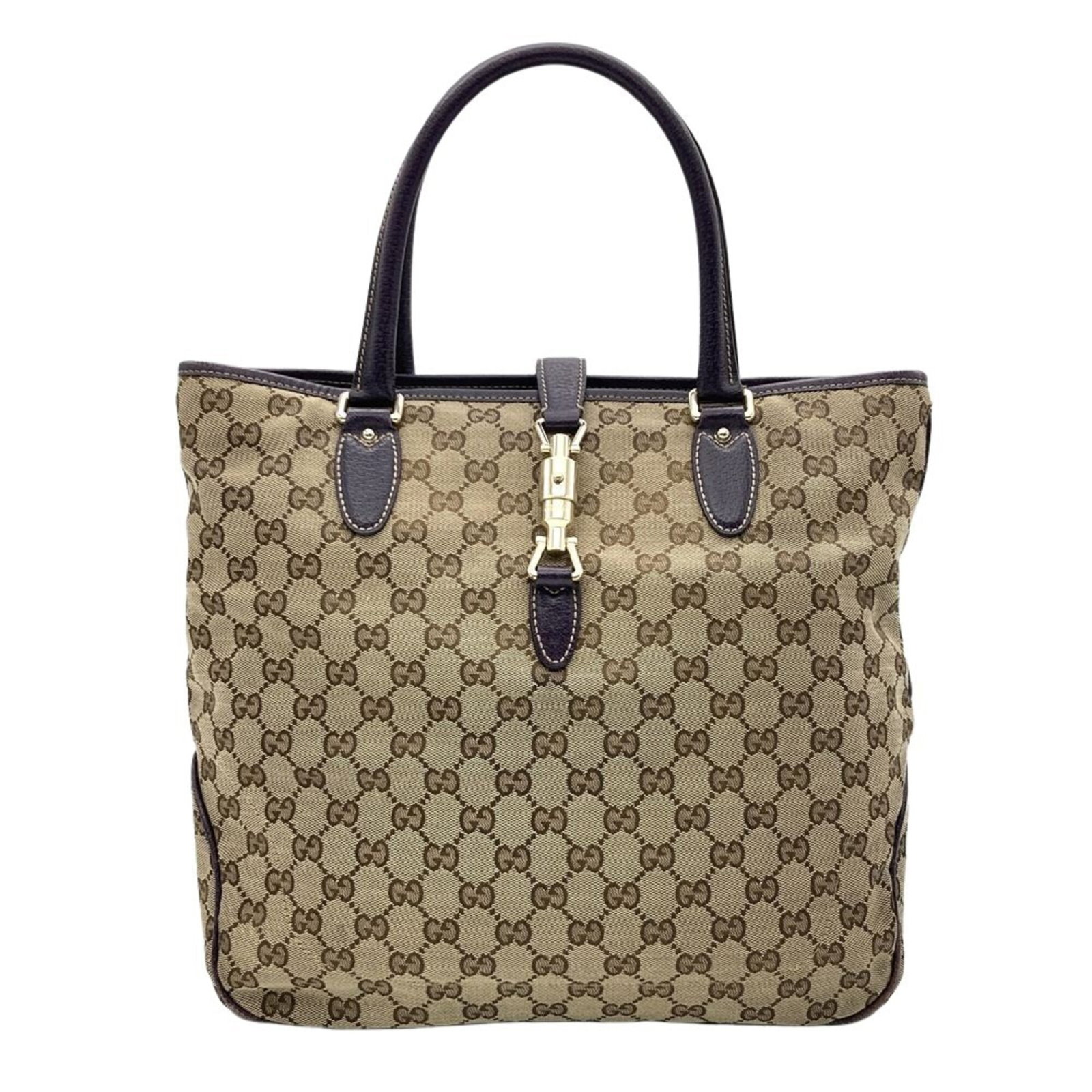 Gucci Handbag Gg Canvas: Gucci Handbag Gg Canvas Gucci Handbag Gg Canvas features a striking purple hue and a canvas material. The bag measures 31cm x 31cm x 10cm, with visible traces of usage and minor scratches. Used in