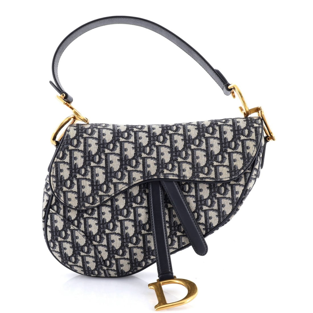 Handbag Canvas Saddle Oblique Medium Christian Dior: Handbag Canvas Saddle Oblique Medium Christian Dior Canvas Saddle Oblique Medium Handbag in Blue. This classic Christian Dior shoulder bag features a timeless oblique design with a medium canvas exter