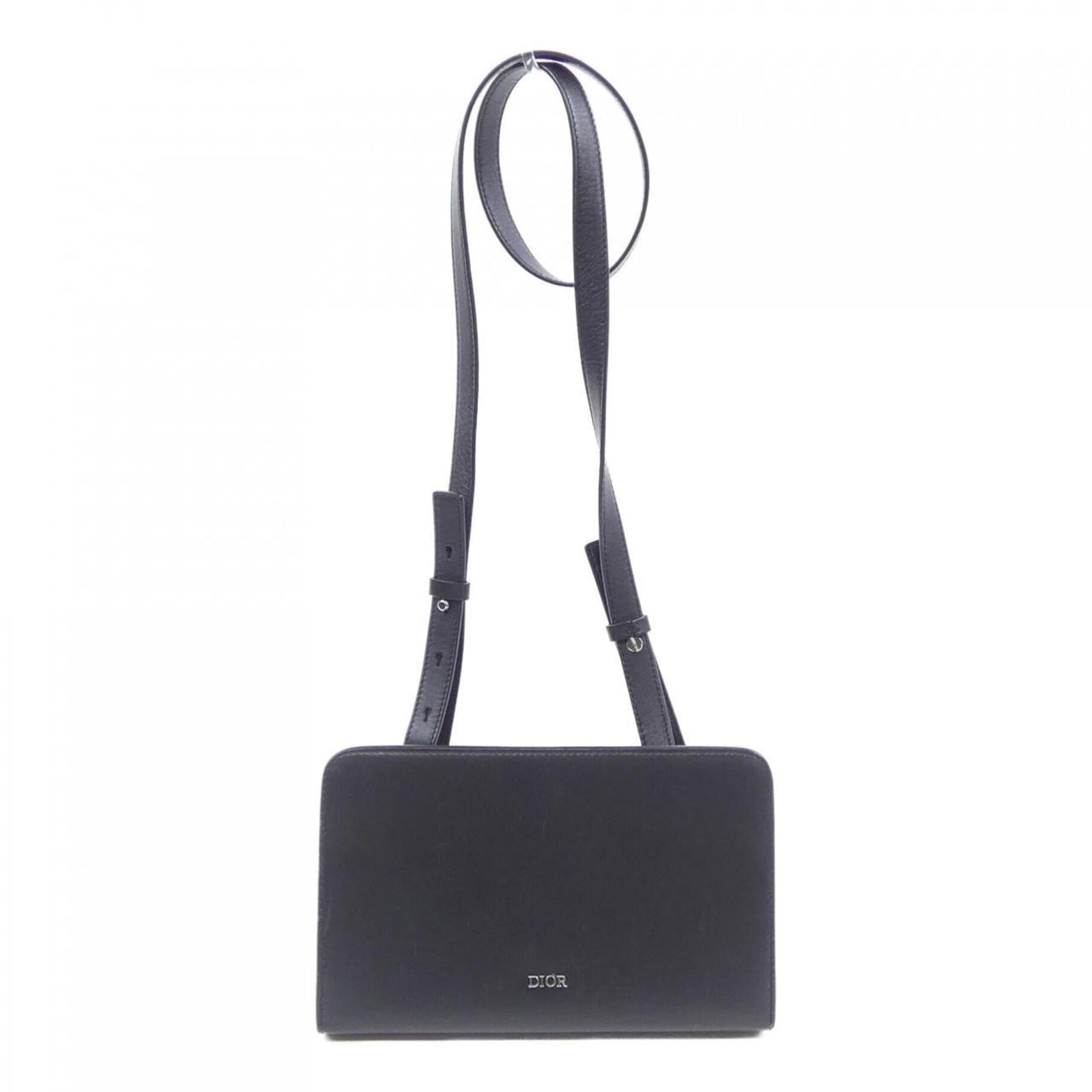 Christian Dior Handbag: Christian Dior Handbag This Christian Dior handbag is a classic black design with a timeless silhouette. Measuring 11.5cm x 19cm x 3cm, it features a worn exterior with traces of usage and minor