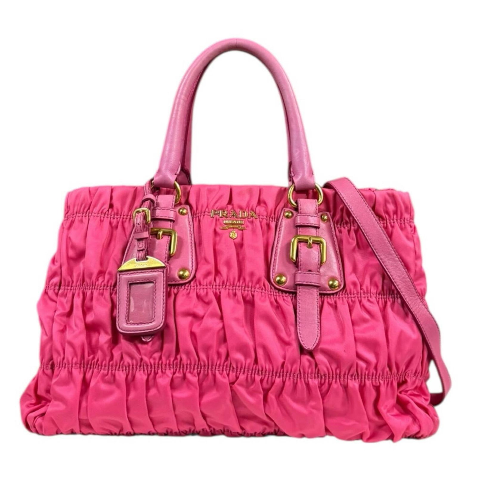 Prada Shoulder Bag Nylon Leather: Prada Shoulder Bag Nylon Leather This Prada shoulder bag combines nylon and leather materials for a unique look. With its distinctive pink color, this stylish accessory features a size of 24cm x 34cm 