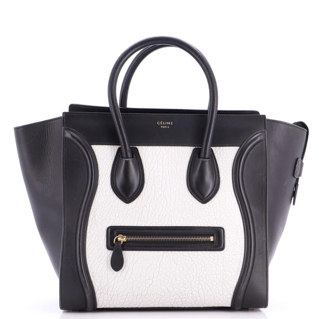 Luggage bag in leather for mini bags: Luggage bag in leather for mini bags This Celine leather mini luggage bag features a timeless black exterior with aged gold hardware and a classic top handle design. With its compact size and sturdy s