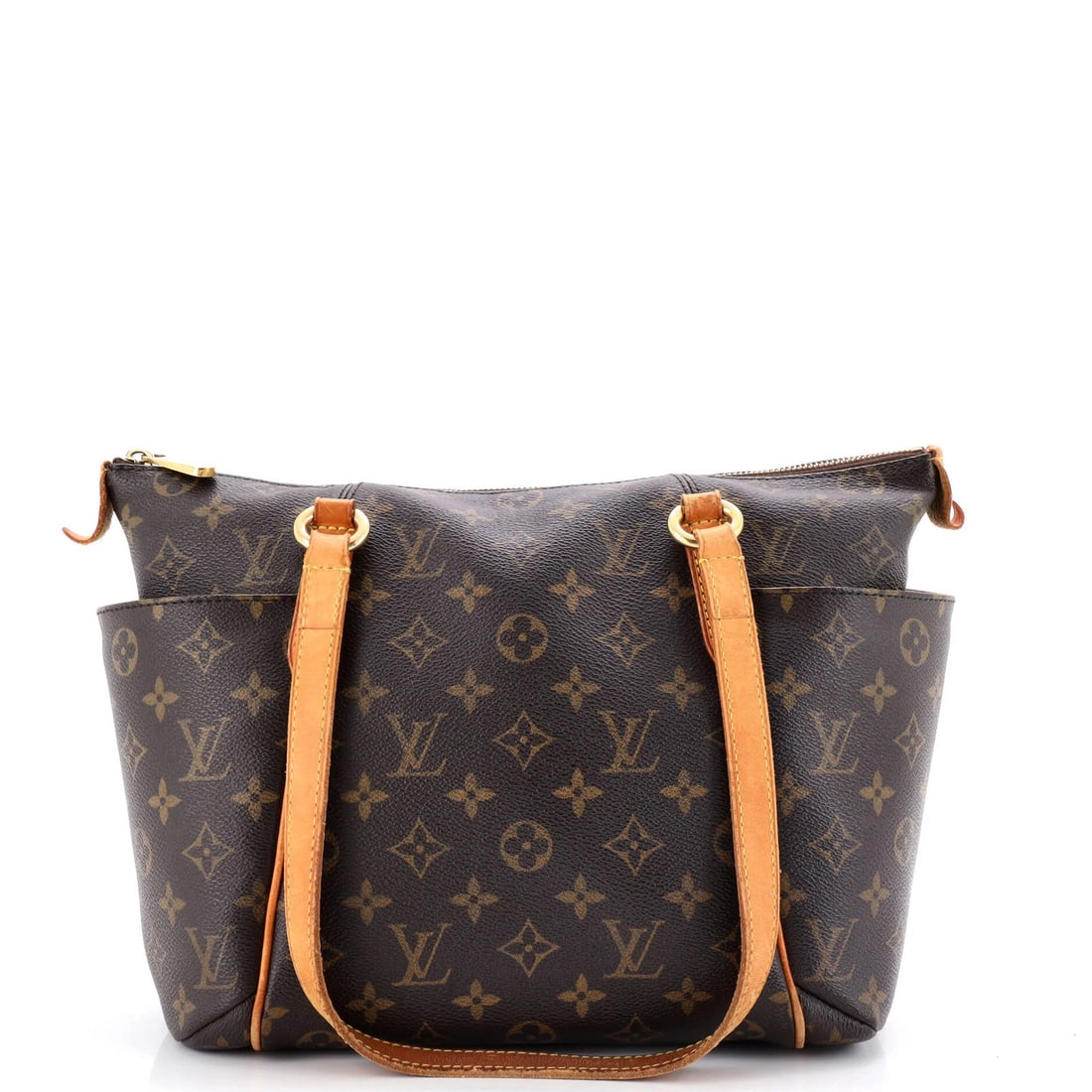 Totally monogram canvas handbag by Louis Vuitton: Totally monogram canvas handbag by Louis Vuitton Totally monogram canvas handbag by Louis Vuitton boasts a classic design with heavy edge wear and scuffs on its exterior. The interior features a match