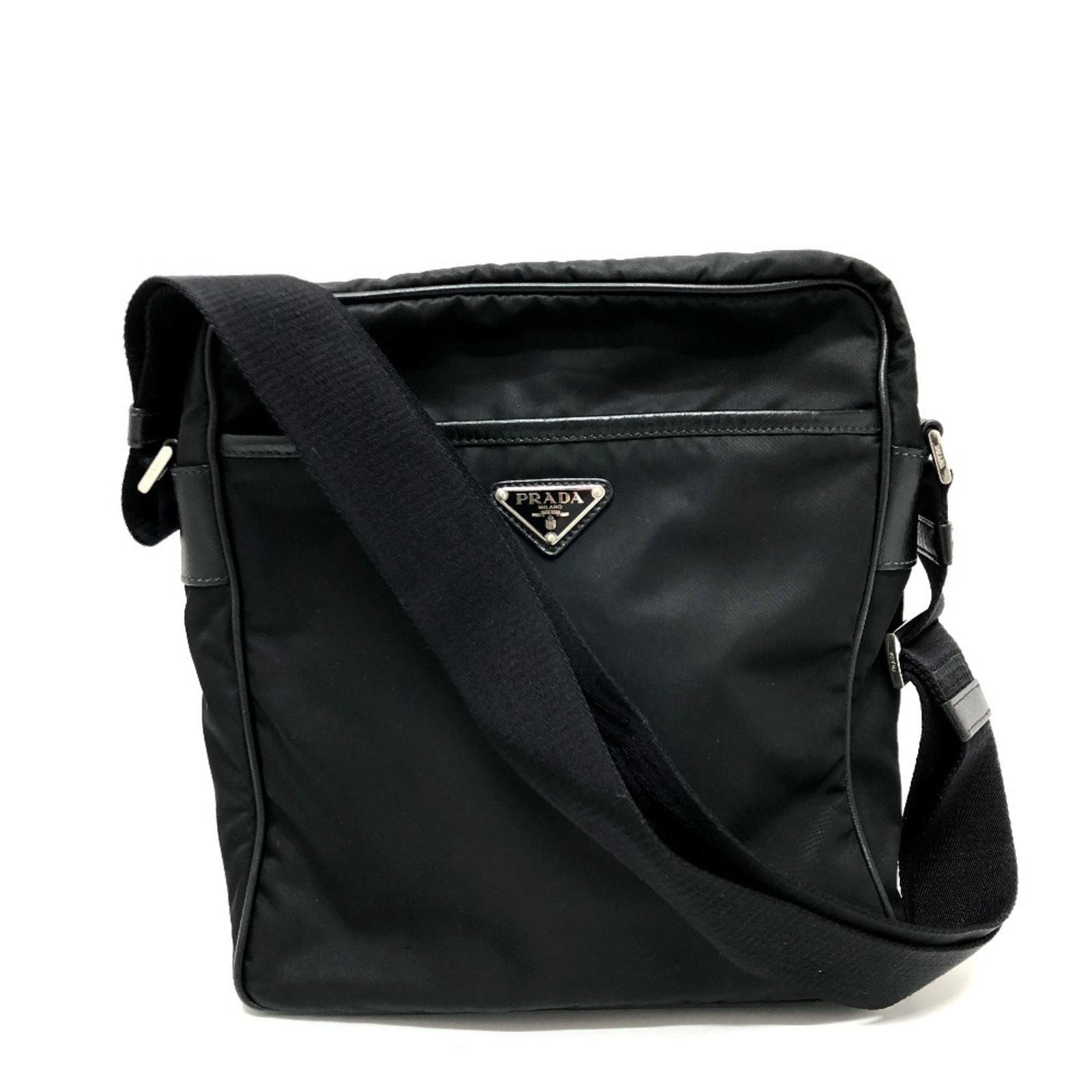 Prada Shoulder Bag Nylon: Prada Shoulder Bag Nylon Black Prada Nylon Shoulder Bag in excellent used condition. This bag features a classic design with a few traces of usage, some scratches and dirt visible, yet overall in very