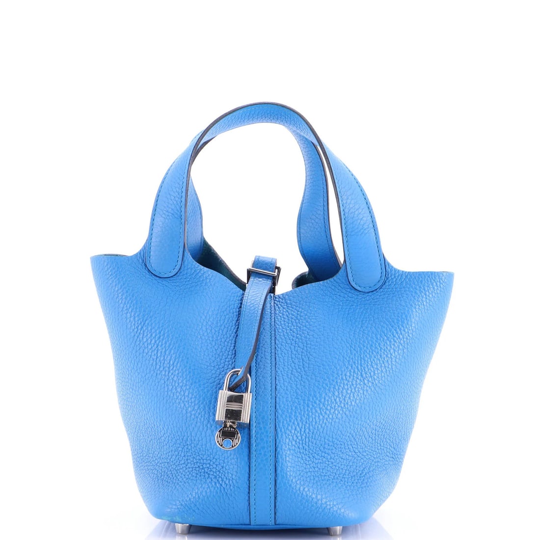Picotine Lock Bag by Clemence: Picotine Lock Bag by Clemence The Picotine Lock Bag by Clemence features a striking blue exterior made from high-quality leather, complemented by raw leather interior and palladium hardware. With its