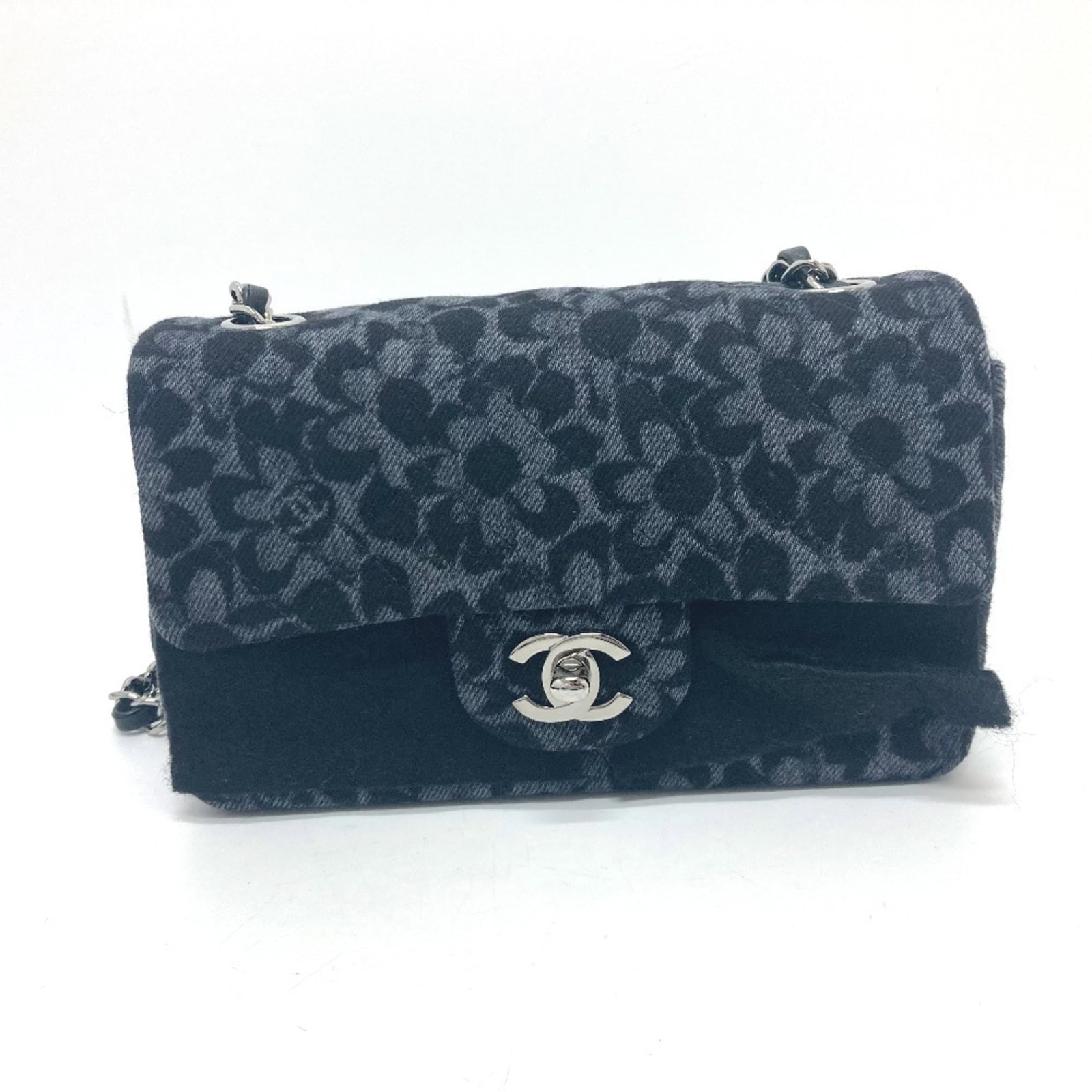 Chanel Shoulder Bag Denim: Chanel Shoulder Bag Denim Chanel's iconic shoulder bag is crafted from high-quality denim in sleek black. The silver hardware adds a touch of sophistication to this timeless design. With its compact s