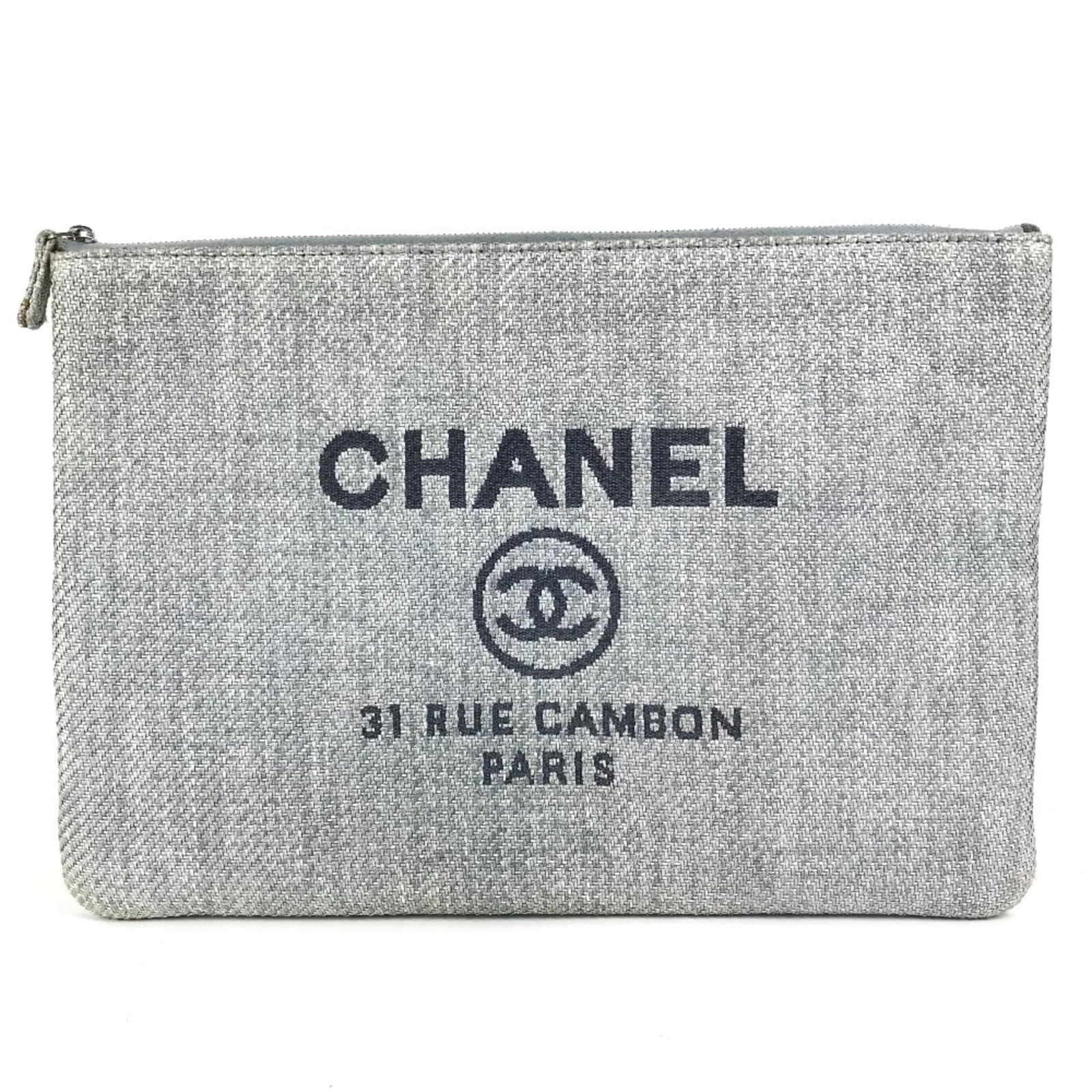 Chanel Clutch Bag Pouch Canvas: Chanel Clutch Bag Pouch Canvas This pre-owned Chanel canvas clutch bag features a striking blue hue and a classic design. With its 23.5cm x 34cm dimensions and zipper closure, it's a versatile accesso