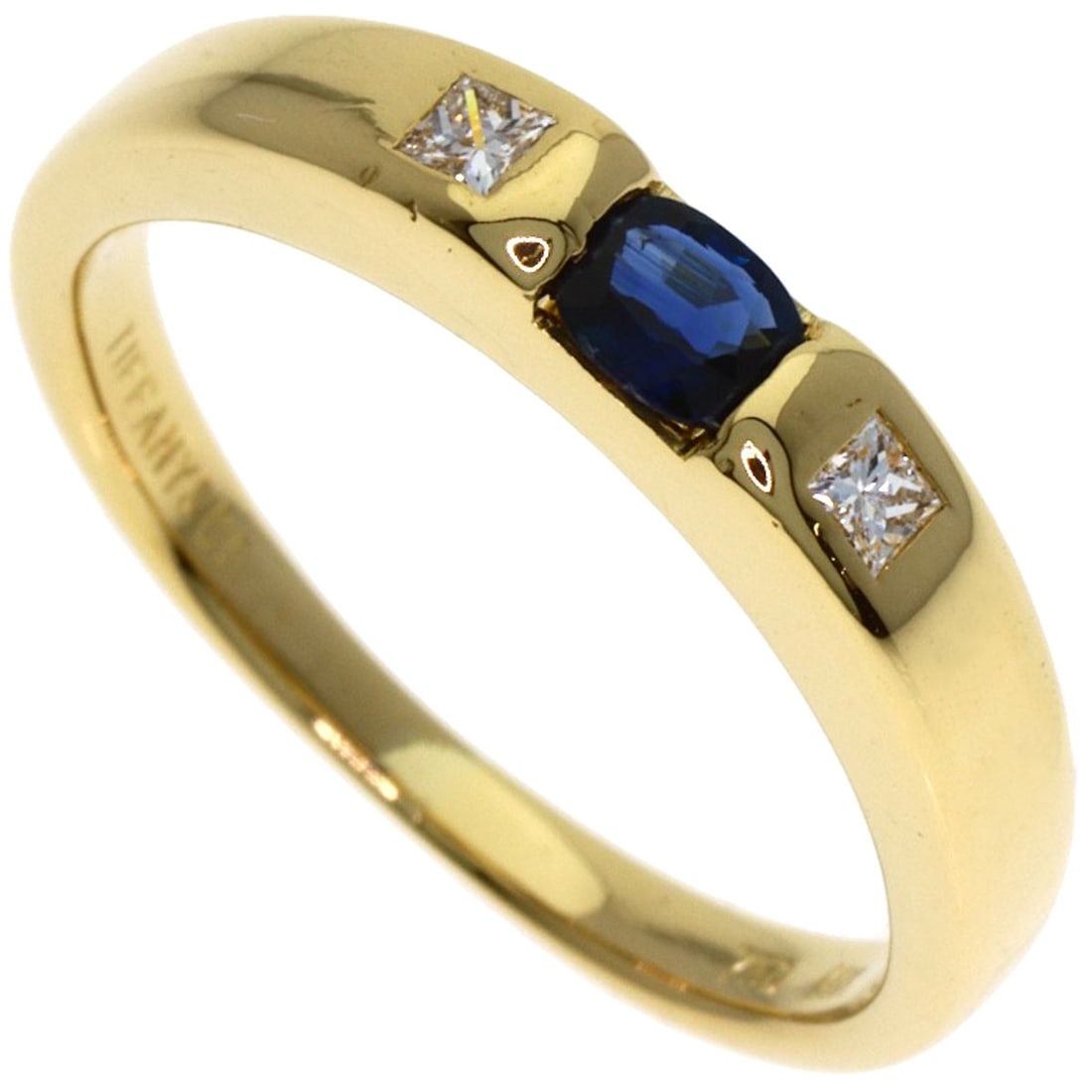 Strict rules apply to this diamond ring made of yellow gold with a sapphire and diamond stack: Strict rules apply to this diamond ring made of yellow gold with a sapphire and diamond stack K18 yellow gold Tiffany&Co. ring with a stunning sapphire and diamond stack stands out for its unique comb