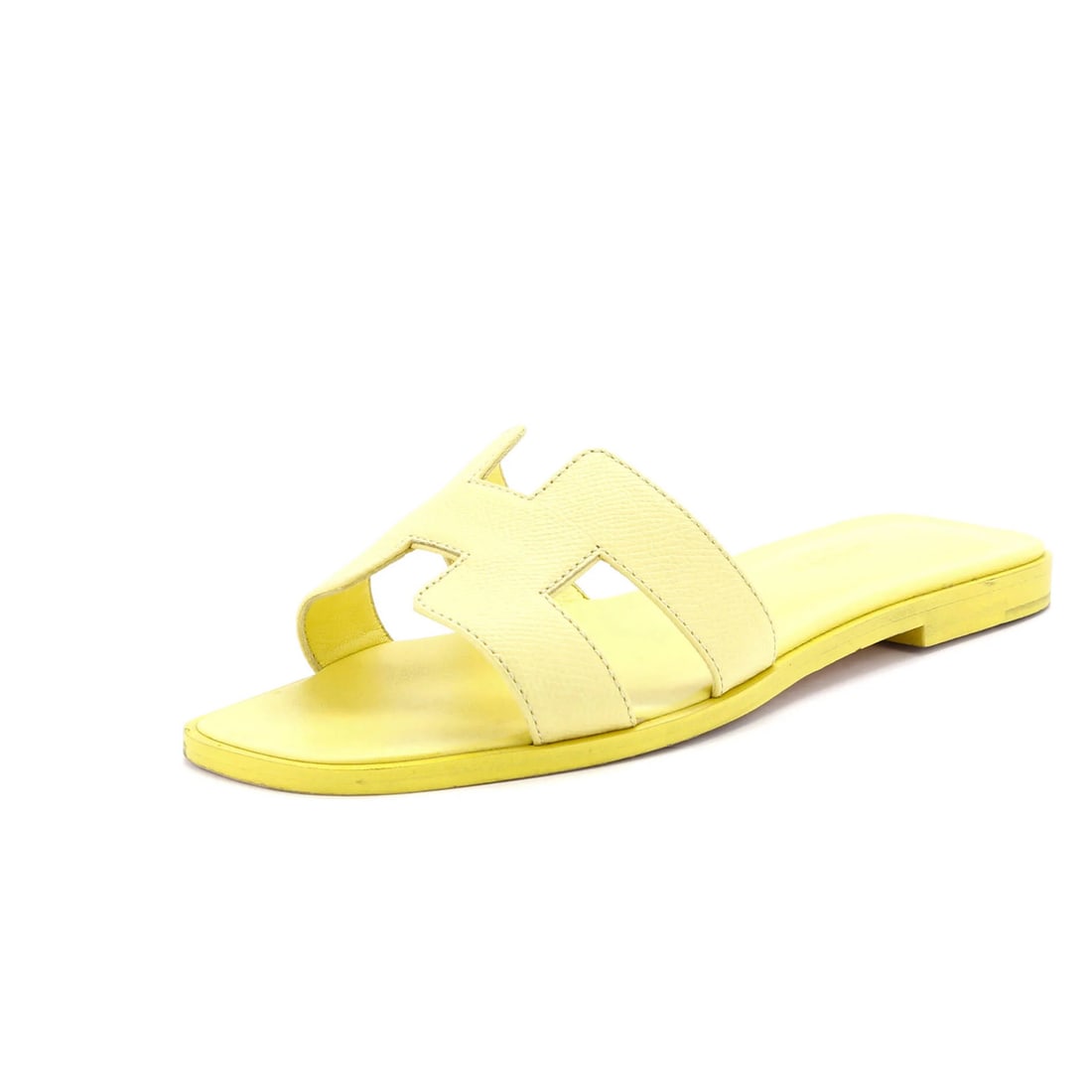 Sandals Leather Oran Hermes Women's: Sandals Leather Oran Hermes Women's Yellow Leather Oran Sandals from Hermes. This women's sandal features yellow leather upper and interior, with minor creasing and scuffs throughout. The exterior has