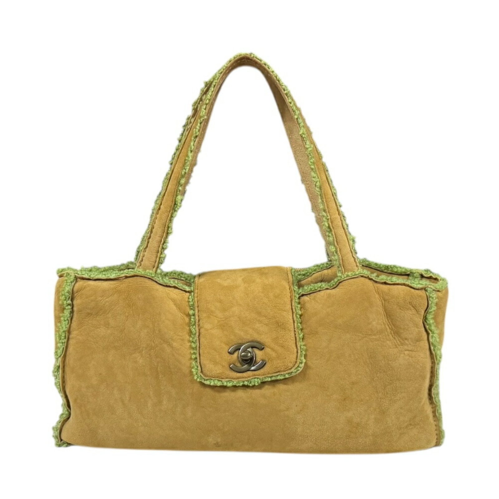 Chanel Handbag Leather: Chanel Handbag Leather This luxurious Chanel handbag features rich brown and green Mouton leather, crafted with attention to detail. With its classic turn lock closure and sturdy design, this timeless