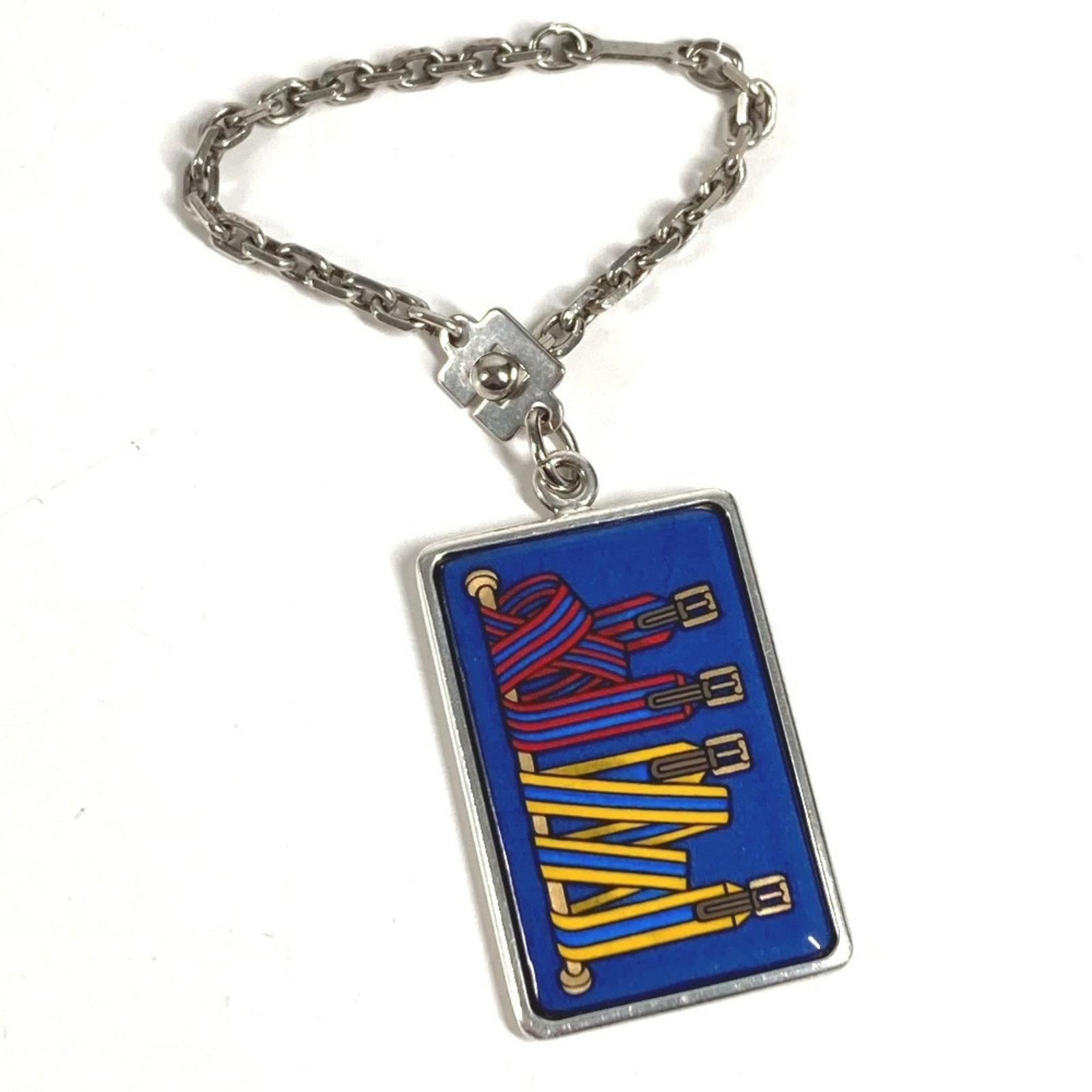Hermes Keyring Metal: Hermes Keyring Metal The Hermes Keyring Metal is a stylish accessory with a blue and silver finish, featuring a metal construction. With its subtle scratches and minor signs of wear, this keyring has 