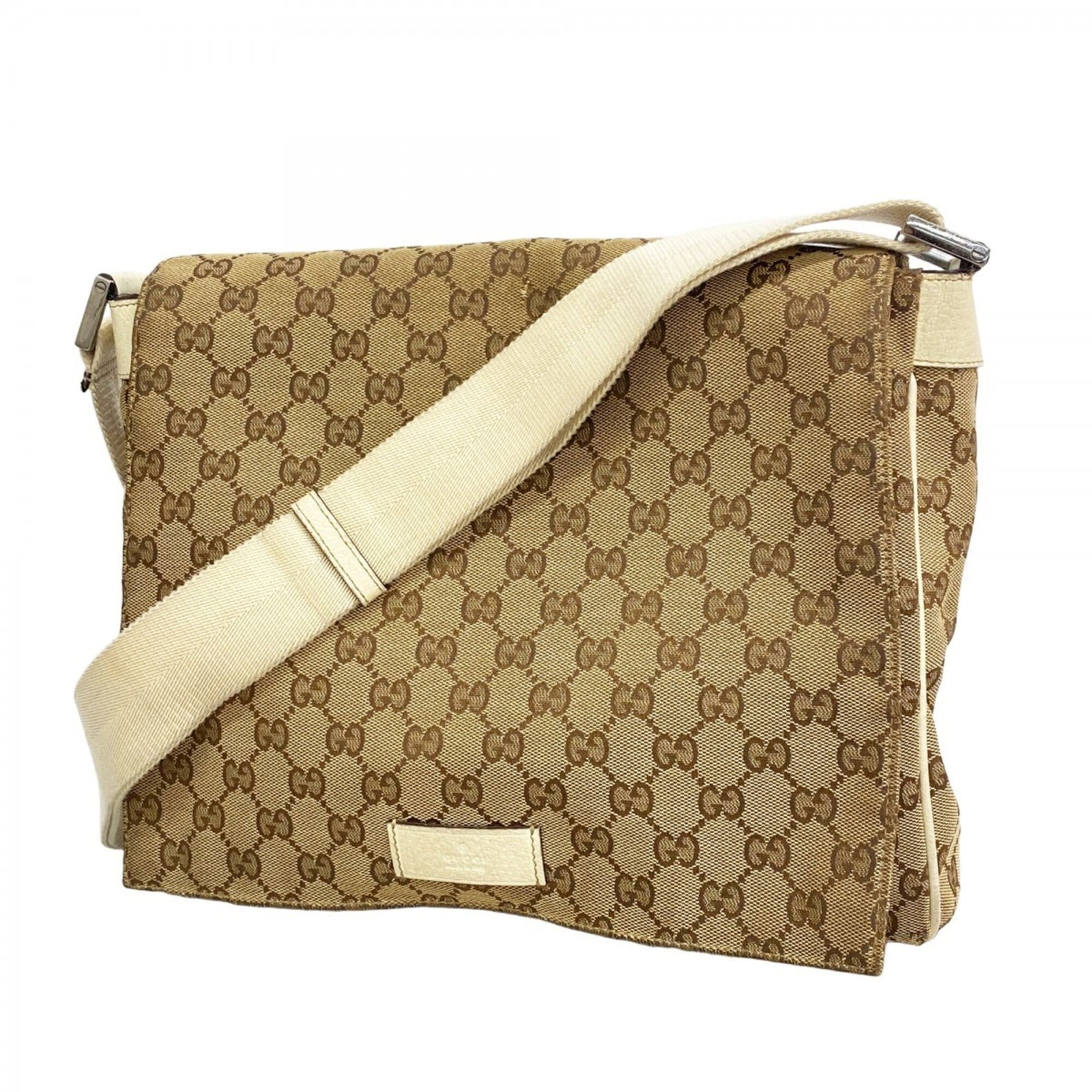 Gucci Shoulder Bag Canvas: Gucci Shoulder Bag Canvas The Gucci Shoulder Bag Canvas boasts a timeless design with its classic brown canvas material and sleek silver hardware. With a spacious interior and comfortable shoulder