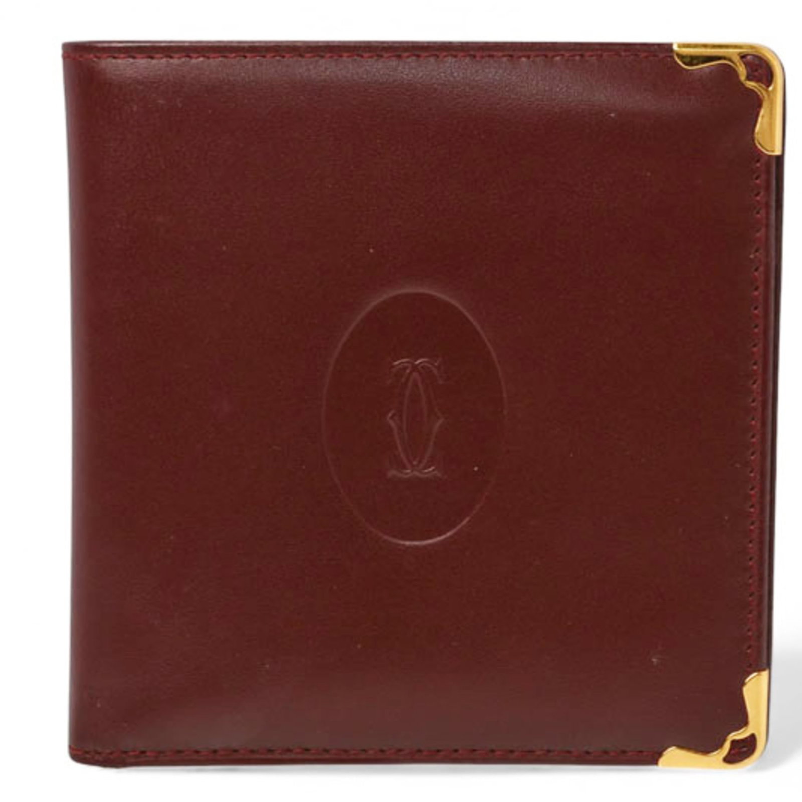 Cartier Wallet (Bi-Fold) Leather: Cartier Wallet (Bi-Fold) Leather Cartier's iconic bi-fold leather wallet boasts classic elegance with its Bordeaux color and timeless design. With a few subtle signs of wear, this pre-owned wallet sti