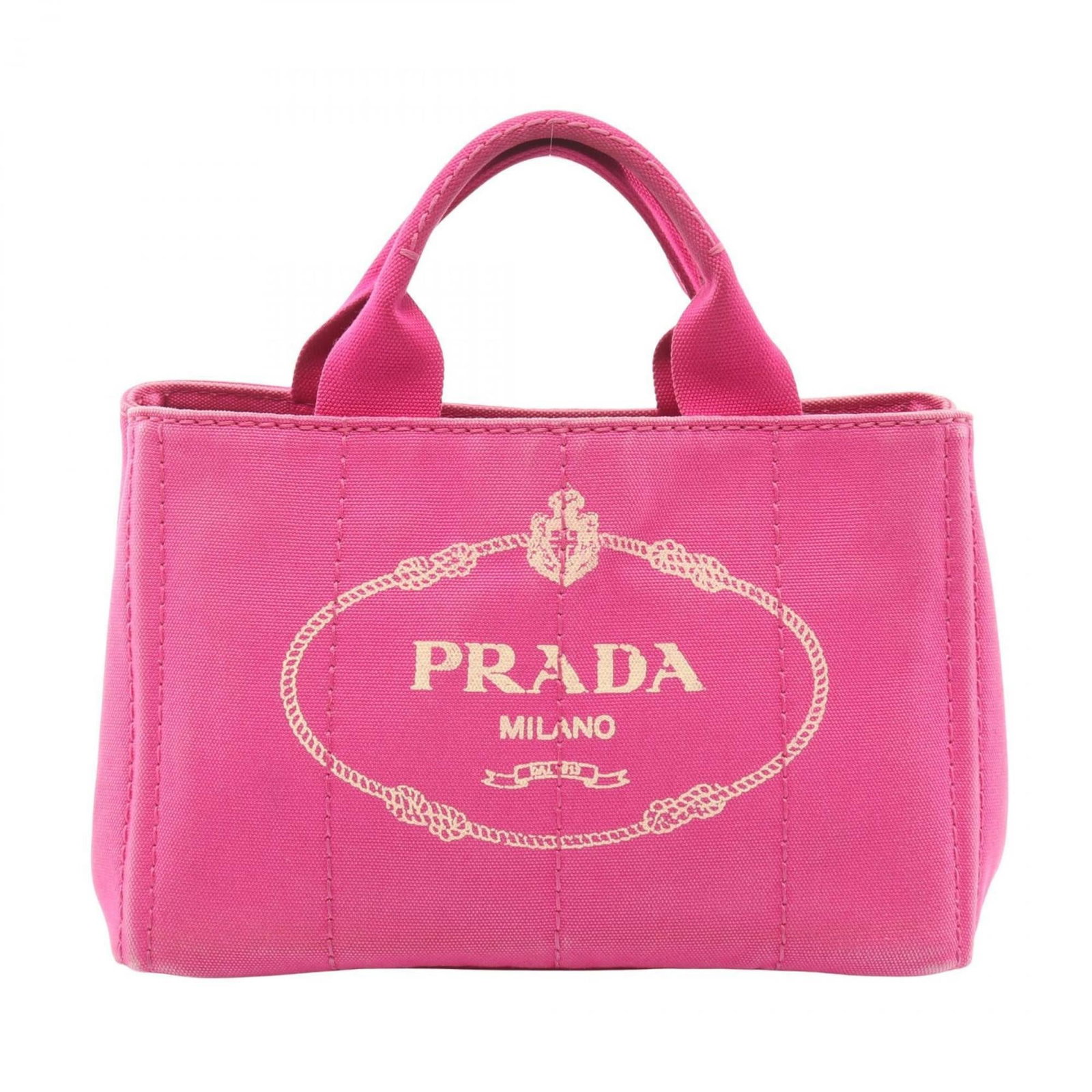 Prada Tote Bag Canvas: Prada Tote Bag Canvas Canvas Prada Tote Bag in Pink. This used tote bag features canvas material and measures 19cm x 28cm x 15cm. It has traces of usage with visible damages and dirt, making it suitab