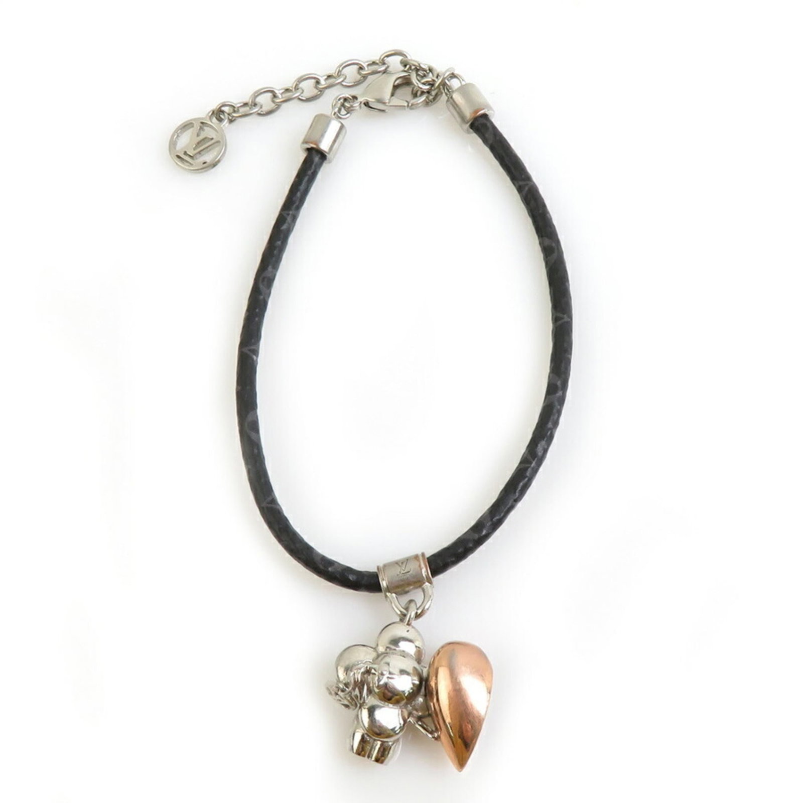 Louis Vuitton Charm Bracelet Canvas Metal Monogram: Louis Vuitton Charm Bracelet Canvas Metal Monogram Canvas metal monogram charm bracelet from Louis Vuitton features a classic design with a black, gold, and silver color scheme. The 19cm length provid