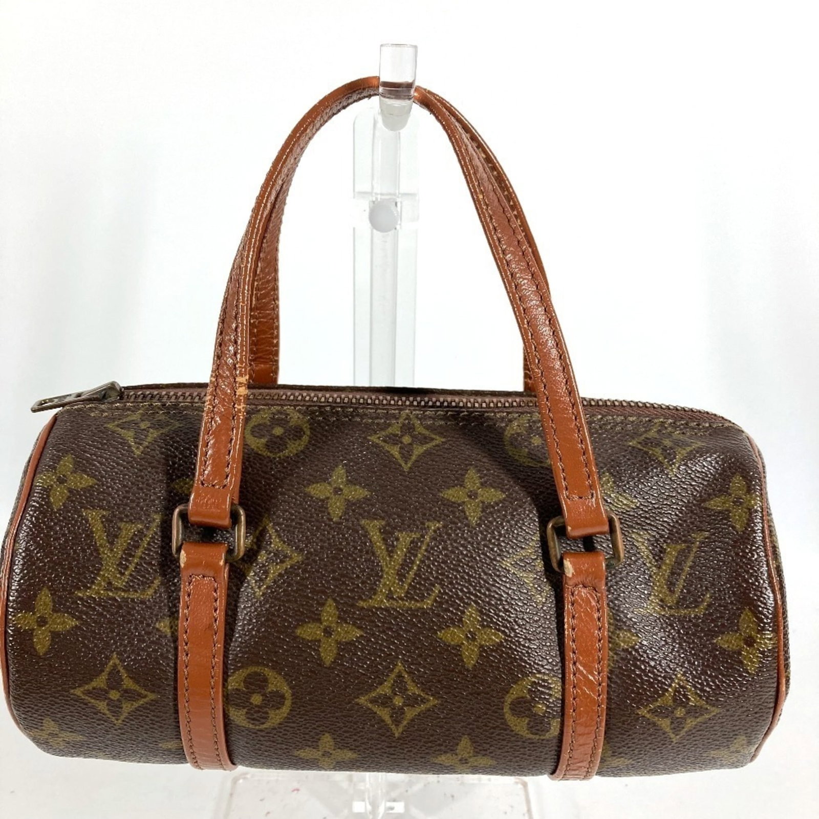 Louis Vuitton Handbag Monogram: Louis Vuitton Handbag Monogram Brown Louis Vuitton Monogram Handbag for sale. This used handbag features the iconic monogram pattern and has a size of 10cm x 22cm x 7cm. It shows traces of usage with 