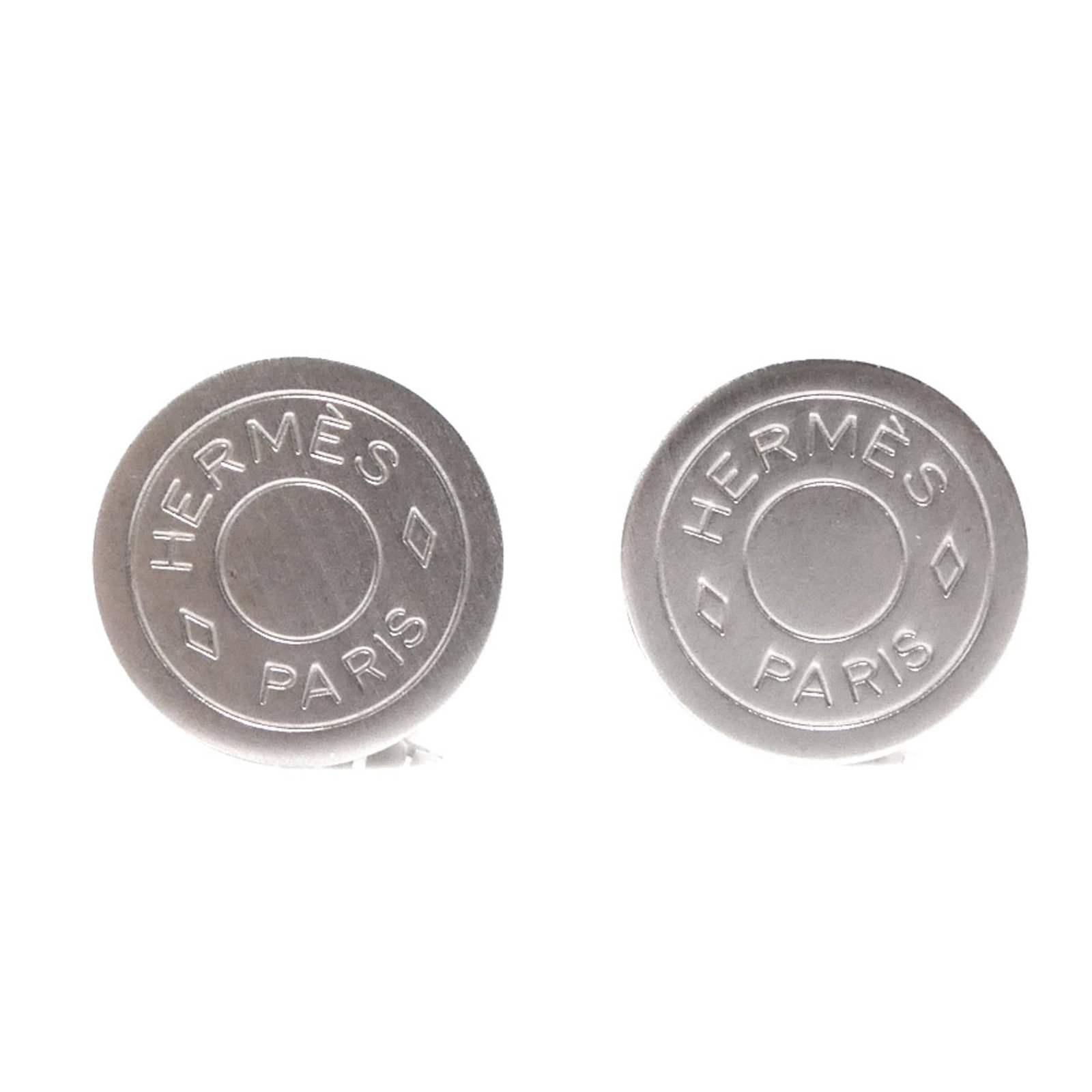 Hermes Clip Earrings Metal: Hermes Clip Earrings Metal Silver Hermes Clip Earrings with Traces of Usage. These metal clip earrings feature the iconic Herm?s brand and have been worn, showing minor scratches and dirt. In good con