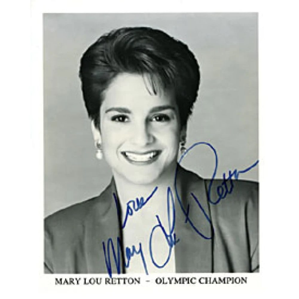 Mary Lou Retton's Olympic Photo: Mary Lou Retton's Olympic Photo Mary Lou Retton's Olympic photo features her iconic moment in black and white, captured with precision. The 8x10 inch image has been signed across the front by Mary