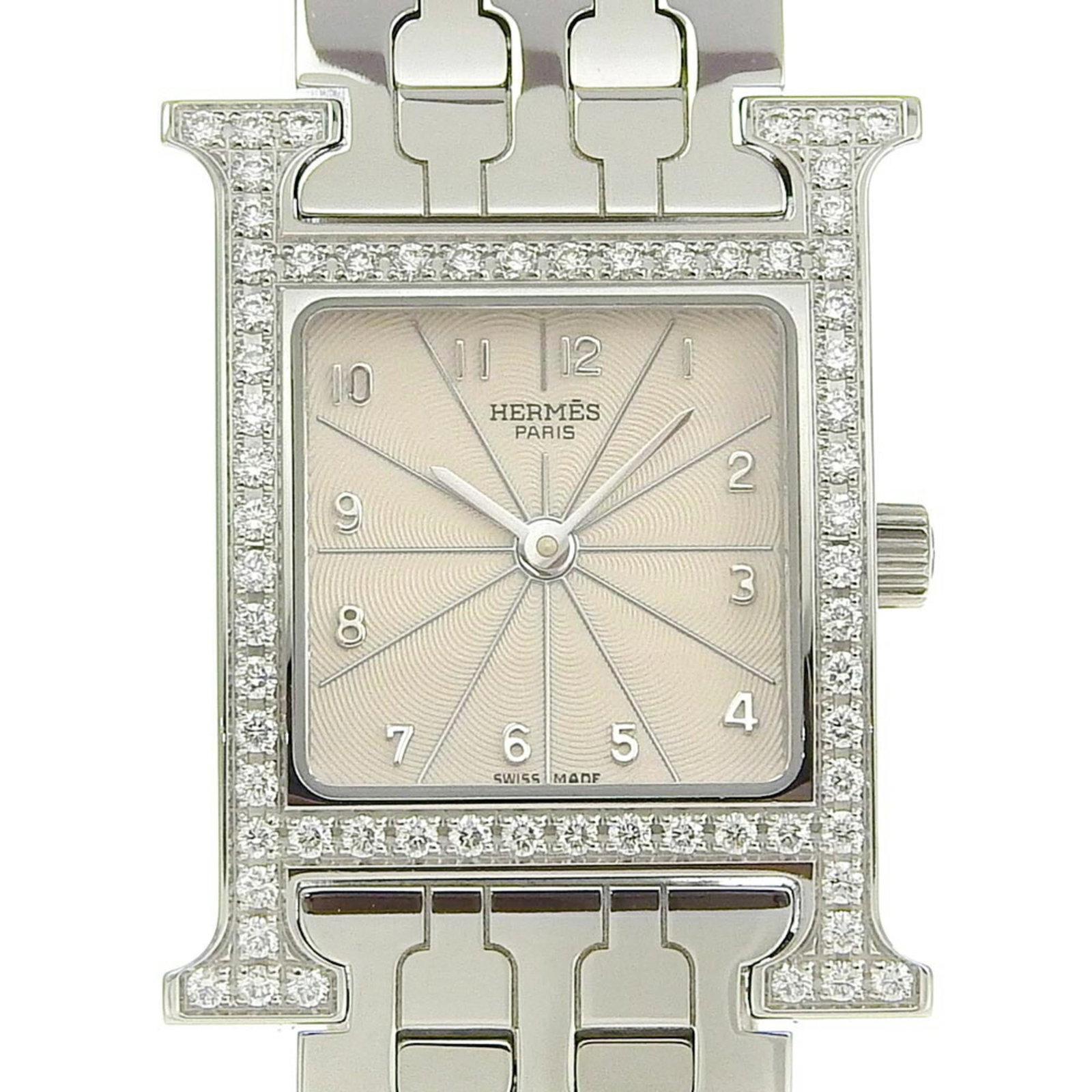 Watch Wrist Hermes: Watch Wrist Hermes Stainless steel case and band provide a sleek, modern look for this women's wristwatch from Hermes. The ivory dial adds a touch of elegance, while the 21mm diameter and 15cm wrist s