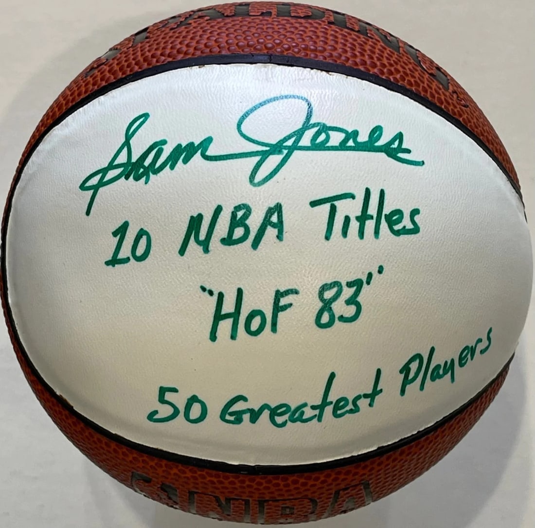 Spalding white panel basketball mini autographed by Jones Sam: Spalding white panel basketball mini autographed by Jones Sam Sam Jones' autographed Spalding white panel mini basketball features his signature in green sharpie across the iconic design. The