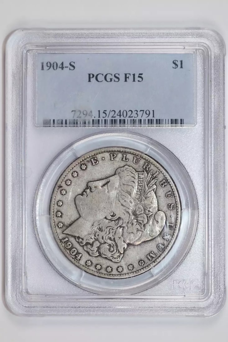 STRICT RULES F15 PCGS MORGAN DOLLAR 1904-S: STRICT RULES F15 PCGS MORGAN DOLLAR 1904-S The 1904-S Morgan dollar features a circulated condition with an F 15 grade from PCGS, indicating some wear and tear. Notable for its San Francisco mint