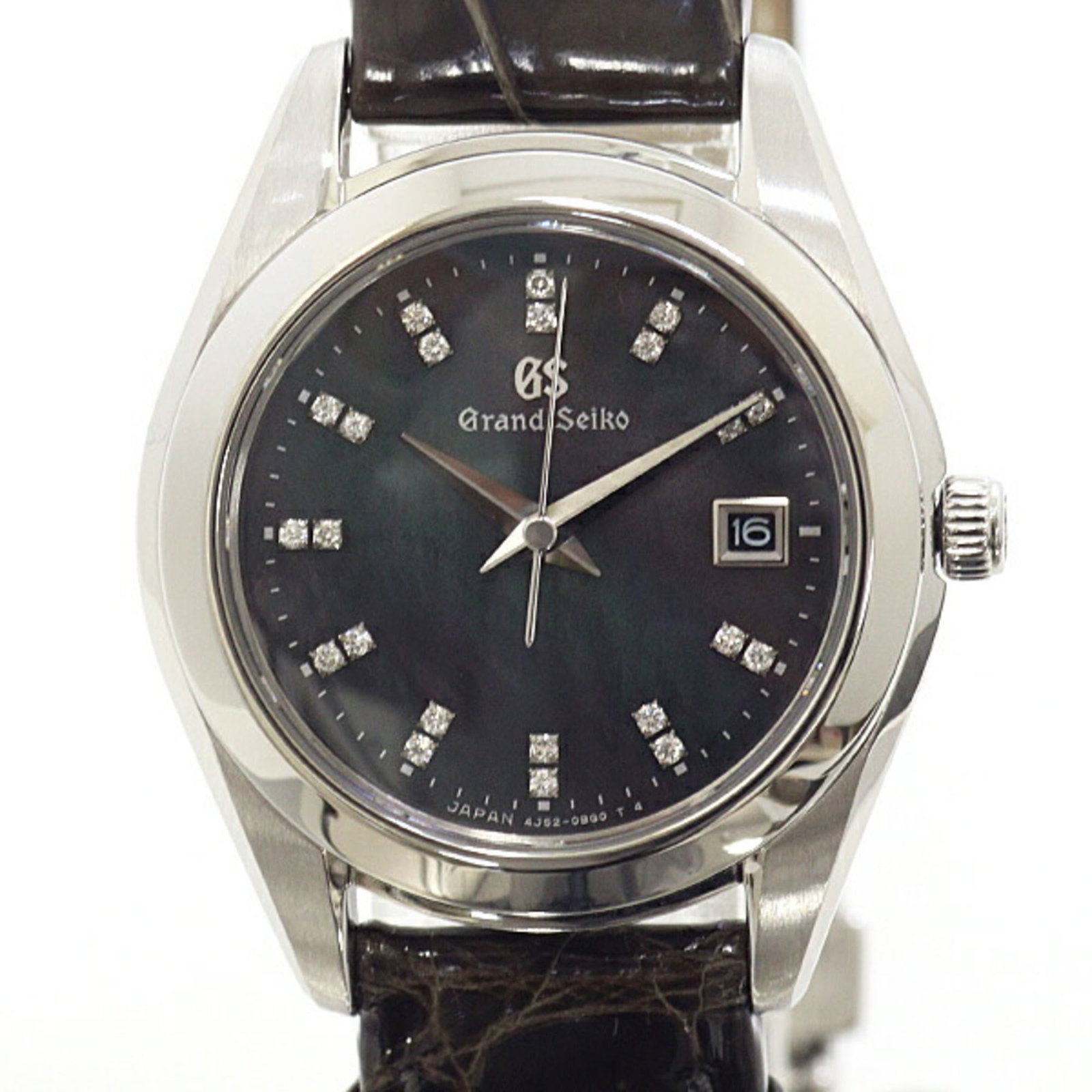 Wristwatch by Seiko: Wristwatch by Seiko Stainless steel and leather come together in this sleek Seiko wristwatch, featuring a black dial with diamond accents. The 28mm case measures 8.7mm thick and weighs just 39g,